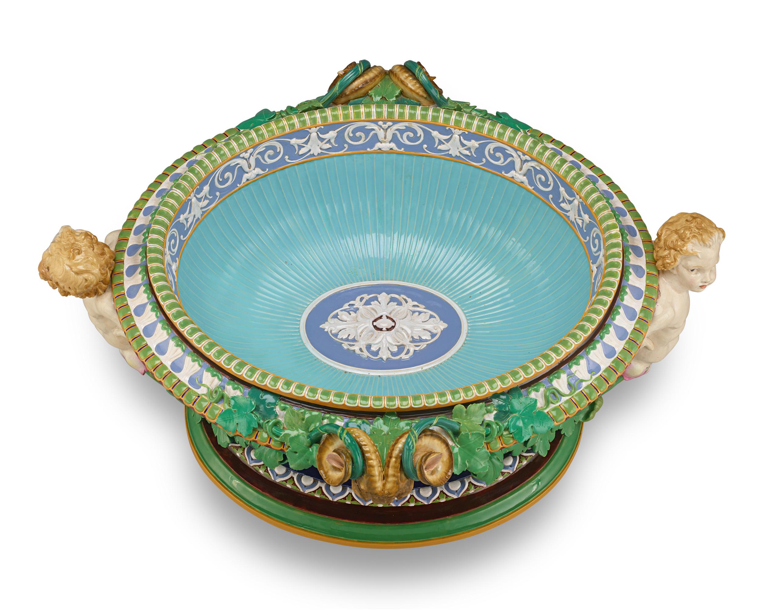 Bearing a cipher mark from 1856, this mid-19th-century centerpiece stands as a crowning achievement of the esteemed firm Minton & Co. This accomplishment of such grand scale in ceramic artistry, combined with intricate detail and rich, jewel-toned