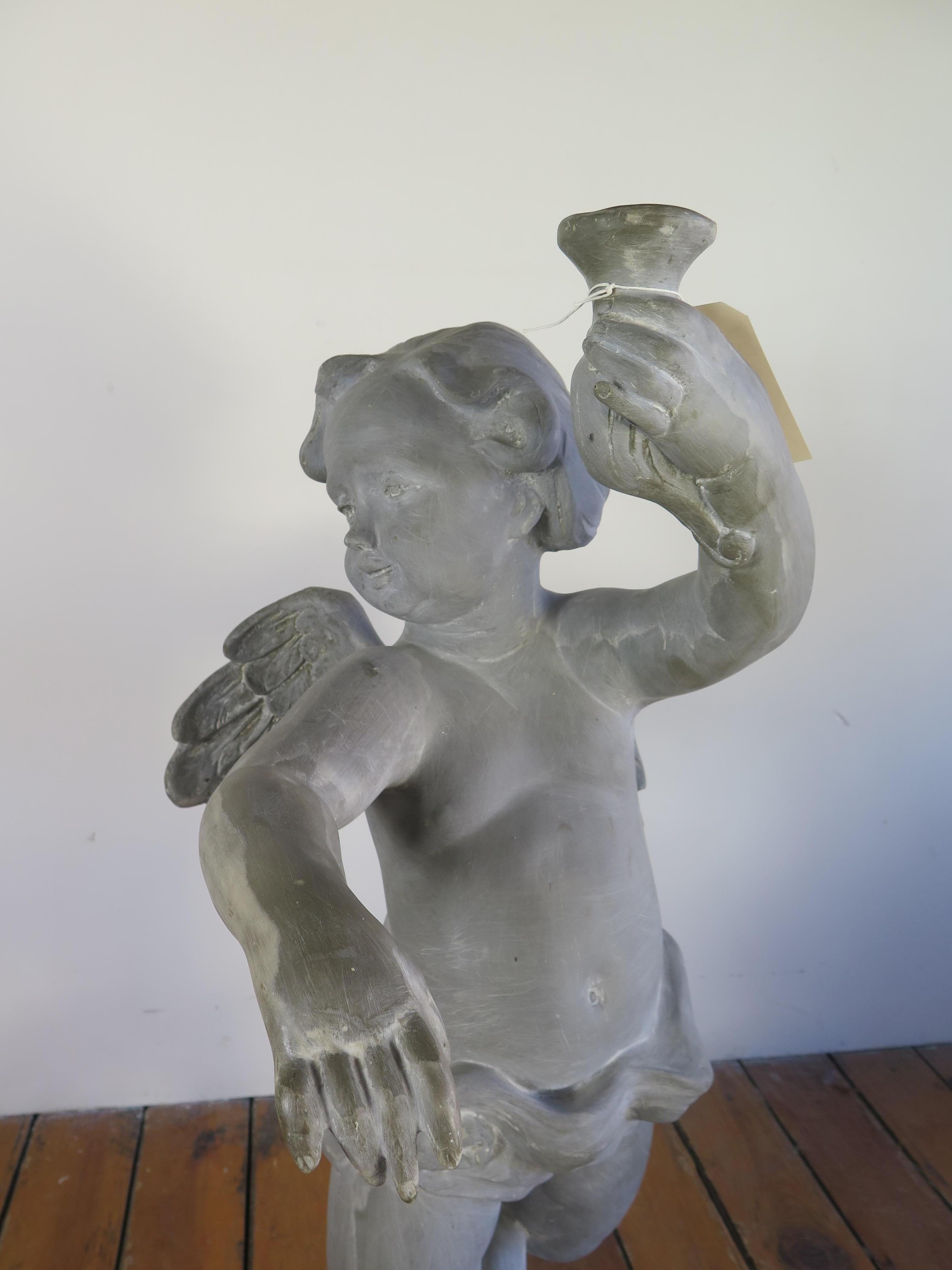 Cherub marble resin statue.