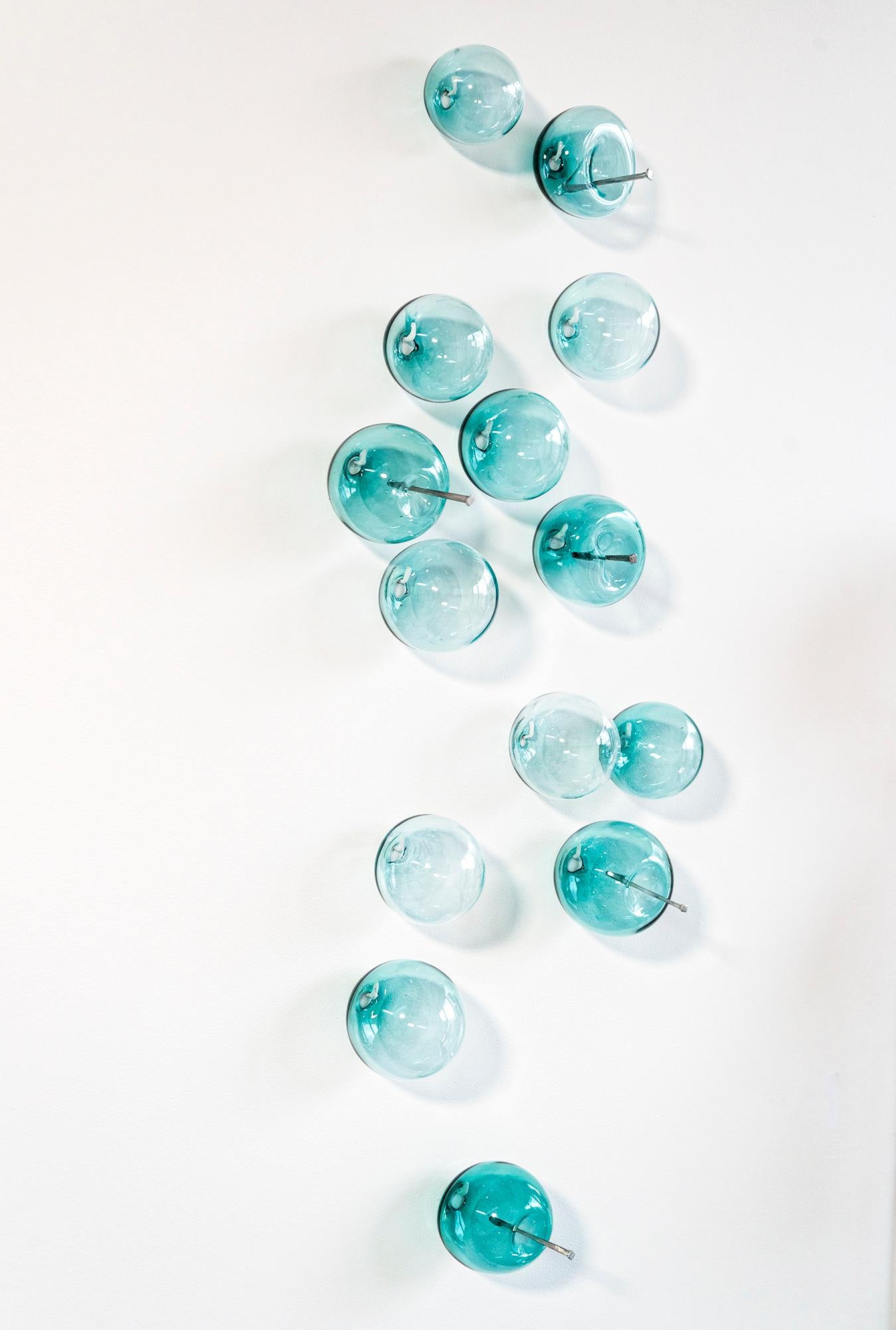 This contemporary turquoise coloured glass wall sculpture was created by Cheryl Wilson Smith.

An award-winning Canadian artist, Wilson Smith is known for her uniquely beautiful glasswork. Its form, colour and texture are often inspired by the