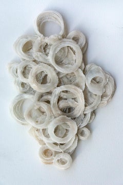 Finding, Rings of White Glass Frit in an Abstract Wall Sculpture
