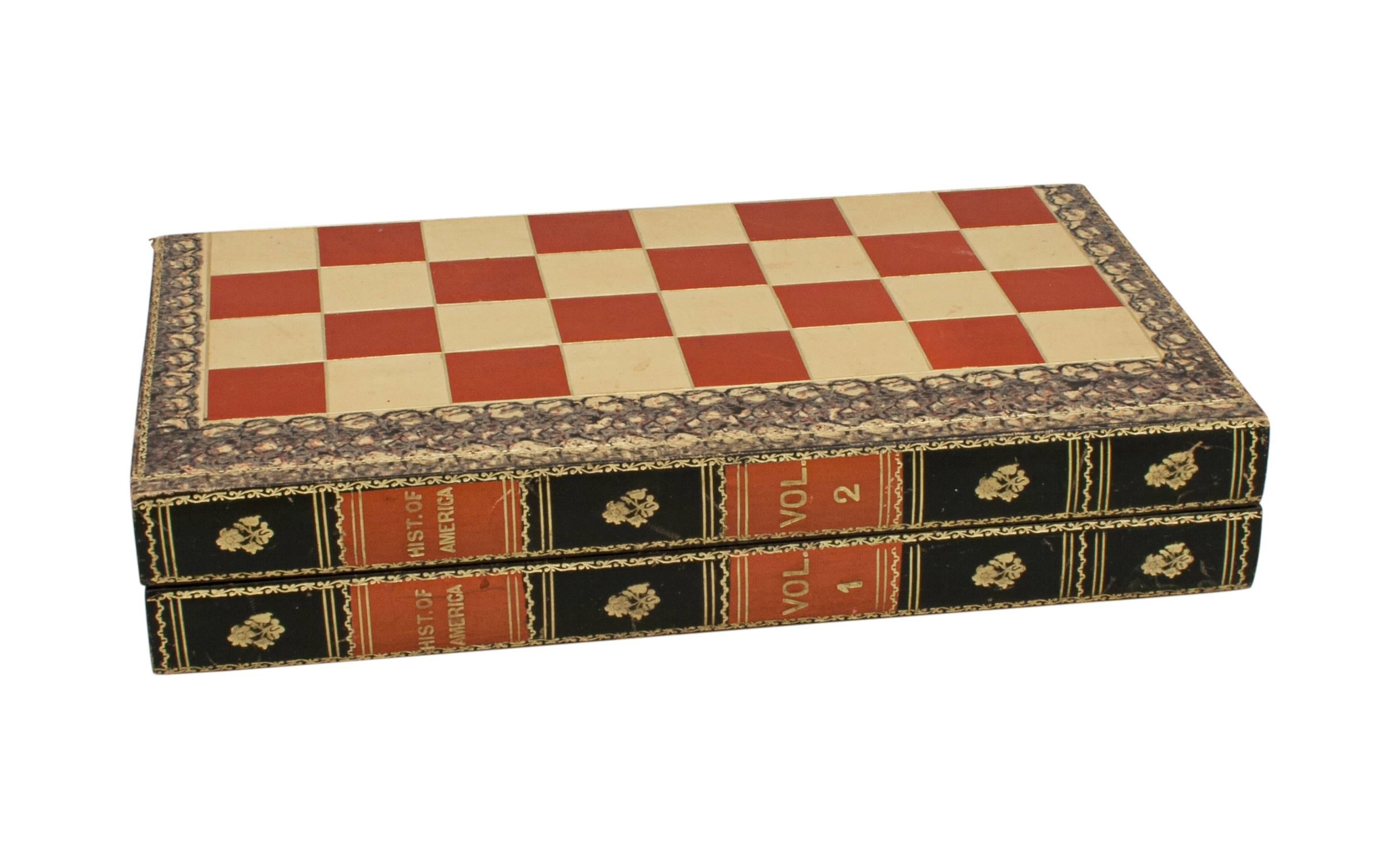 Backgammon, chess and droughts board.
A morocco bound backgammon and droughts board in a folding blind-book form. The chess board made of cream and red leather squares with nice gilt tooling. The spine of the box entitled: Hist. of America Vol 1 &
