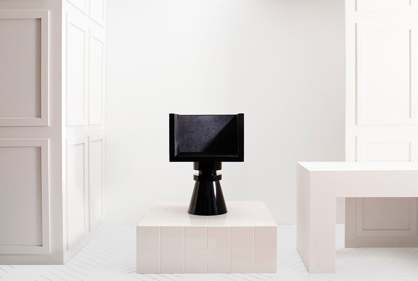 Developed from the Chess series as a piece of functional sculpture. It keeps its clean lines and uses texture to create contrast within the work. Each piece is hand made in New York from black powder-coated steel, with a tub seat lined in black pony