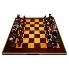 Damier d'échecs avec pièces d'échecs en céramique fabriquées à la main