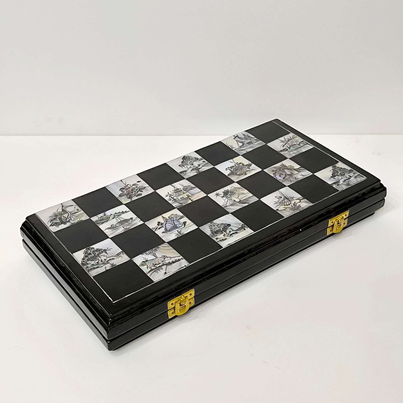 Chess Game Set with Handmade Board Made of Wood and Mother of Pearl Inlaid
An early 1920s Chinese or Vietnamese Export black lacquered Mother-of-Pearl Inlaid Chessboard. The Chessboard measures 38x38cm overall with 4 cm squares. Each square