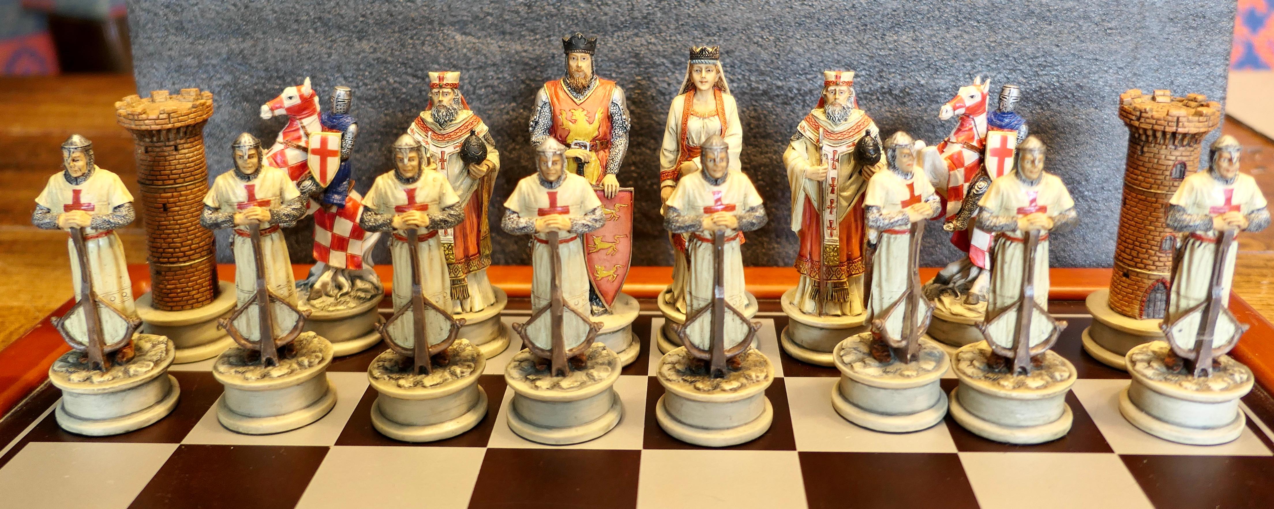 Chess Set with Crusader and Saracen Figures

An interesting slant on the game of chess, these large figures are made in a stone and resin compound, they have been hand painted and are all signed Veronese
The set is in good used condition, it comes