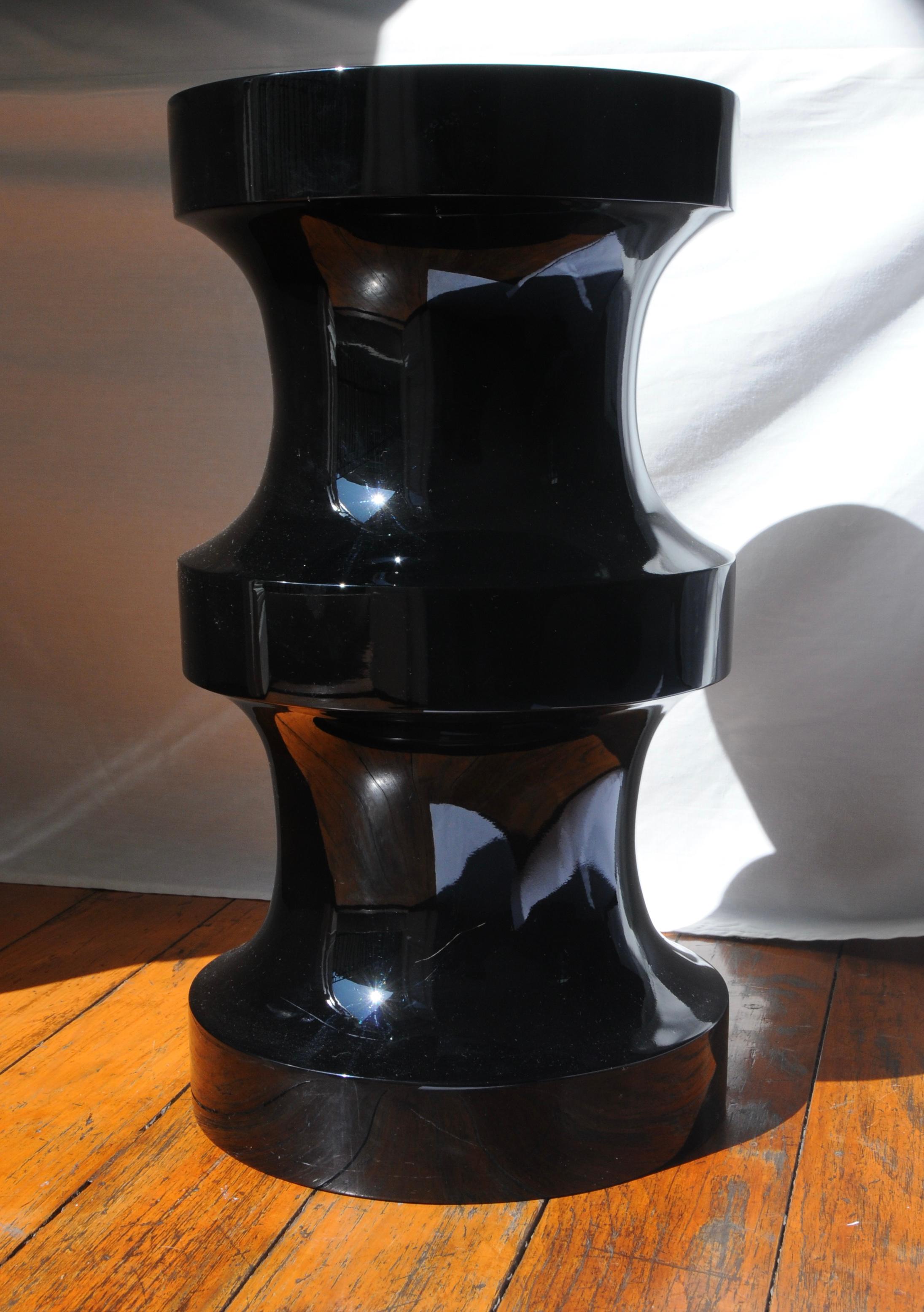 Two hand-turned wooden pieces with an elegant piano polish lacquer play together as sculptural stools or side table sets.