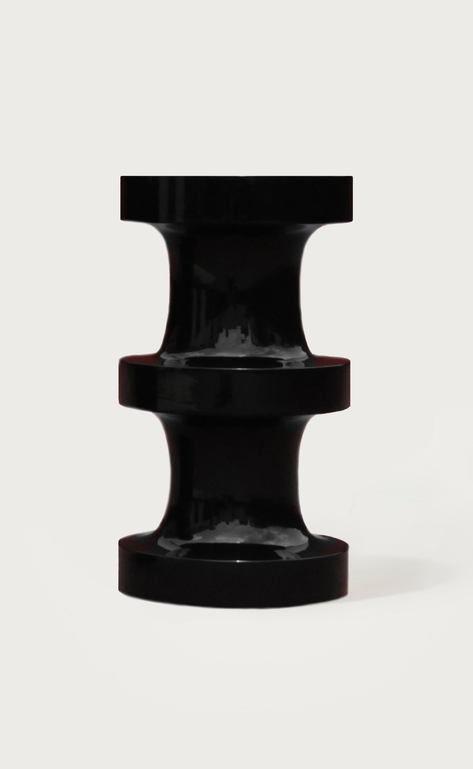 Two hand-turned wooden pieces with an elegant piano polish lacquer play together as sculptural stools or side table sets.