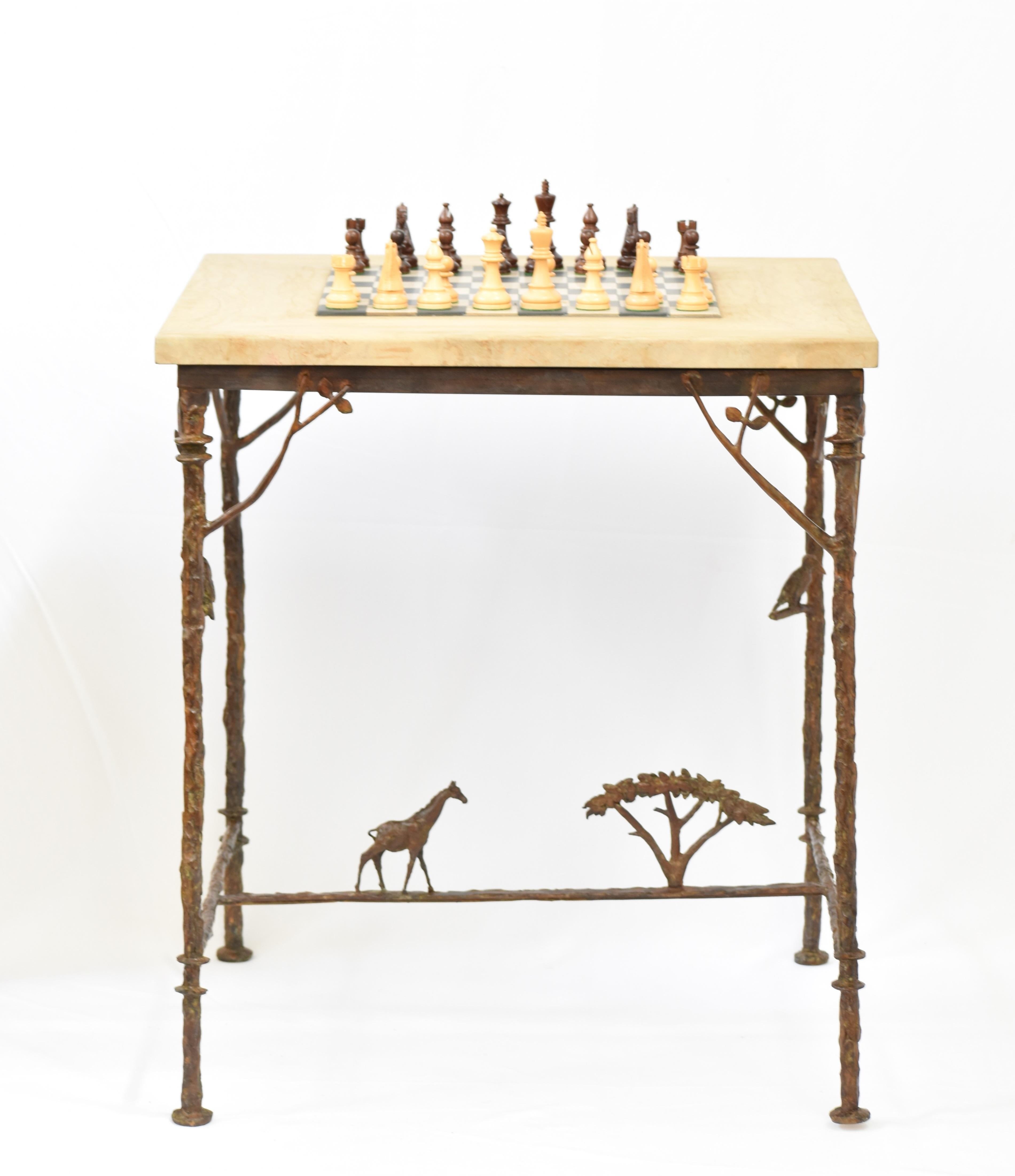 Chess Table in cast bronze
Bespoke Table in cast Bronze inspired by Diego Giacometti with African theme with inset chess board made of sandstone and black slate.  Table featuring a giraffe, acacia tree, hornbill, owl, leaves and twigs - all