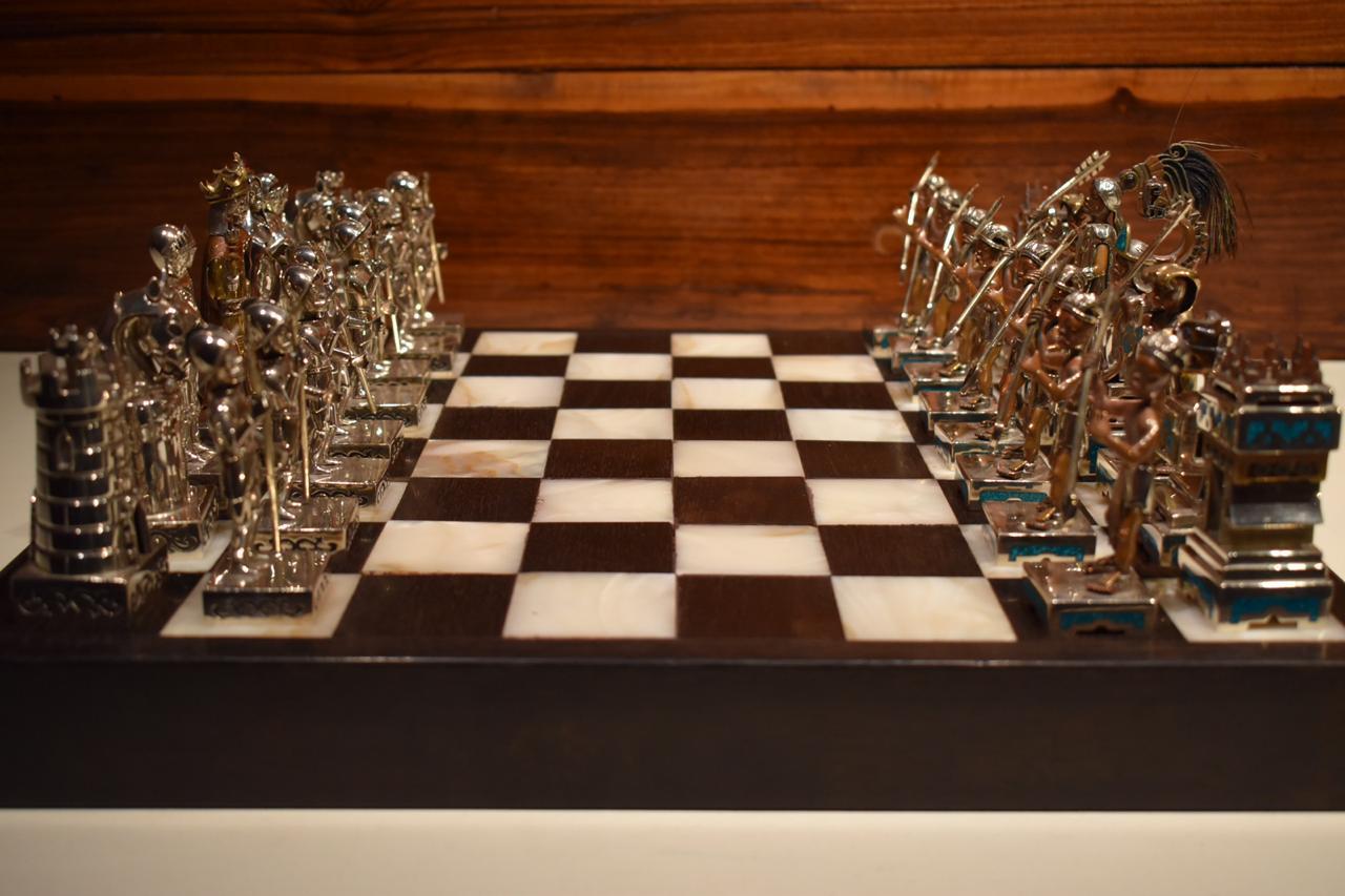 Chess the conquest of Anahuac, winner of the first national silverware award that Mexico was awarded in the contest of the world silverware fair in Brussels. 32 handmade pieces of brass, copper, sterling silver .925 inlaid with turquoise, tiger eye,