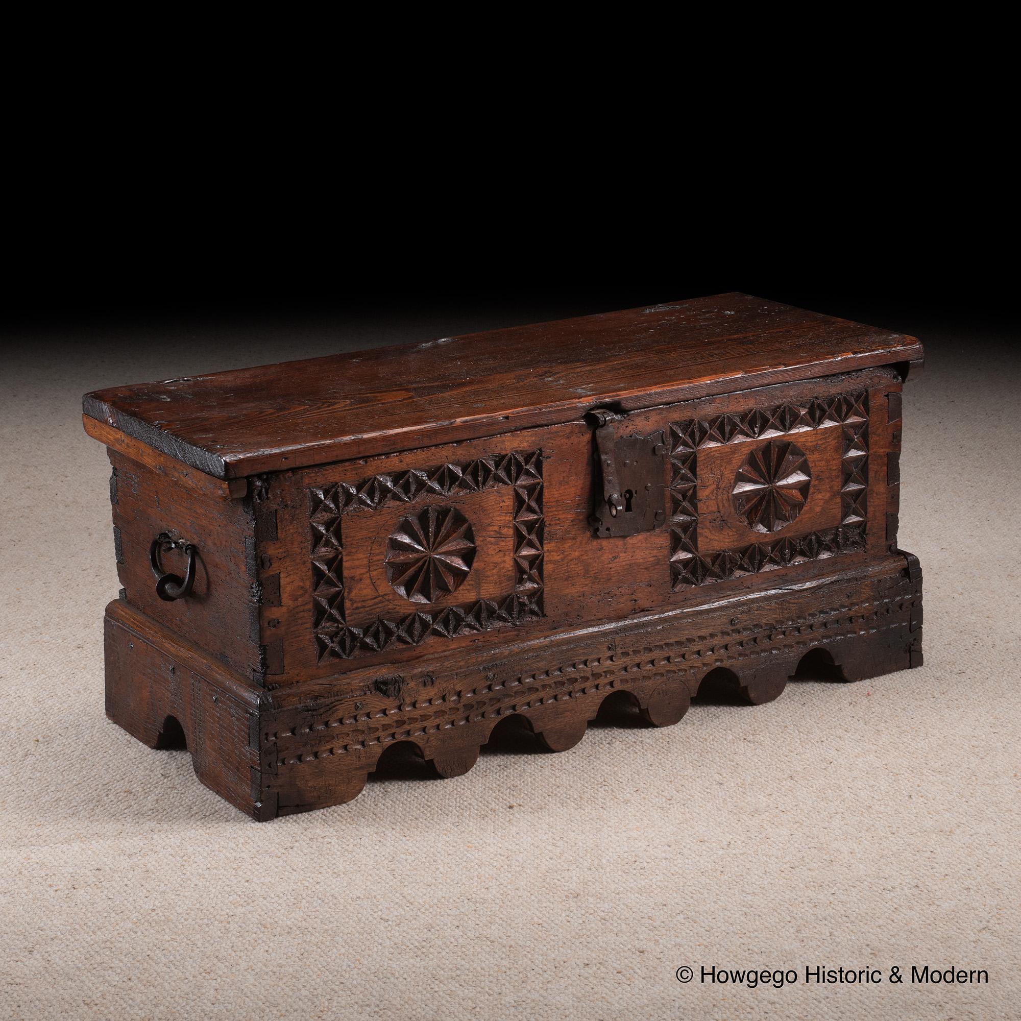 - Rare small size, would work as a sofa or low table with the advantage of storage space
- Characterful chip carving, ironwork and figuring injecting atmosphere into any interior
- Warm, rich, lustrous color and patina.

Single plank top with fine