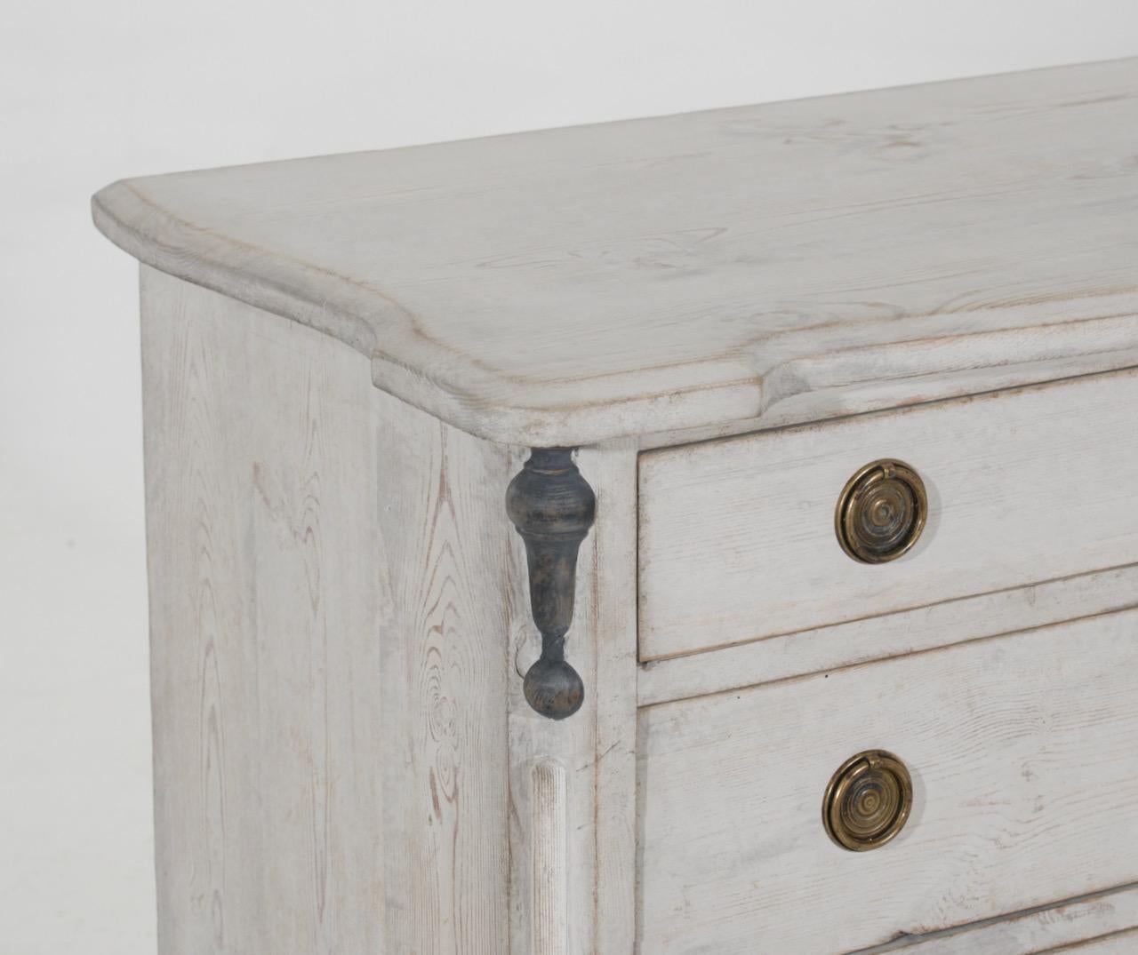 Unusual four drawer chest from Sweden with painted columns, 19th Century.