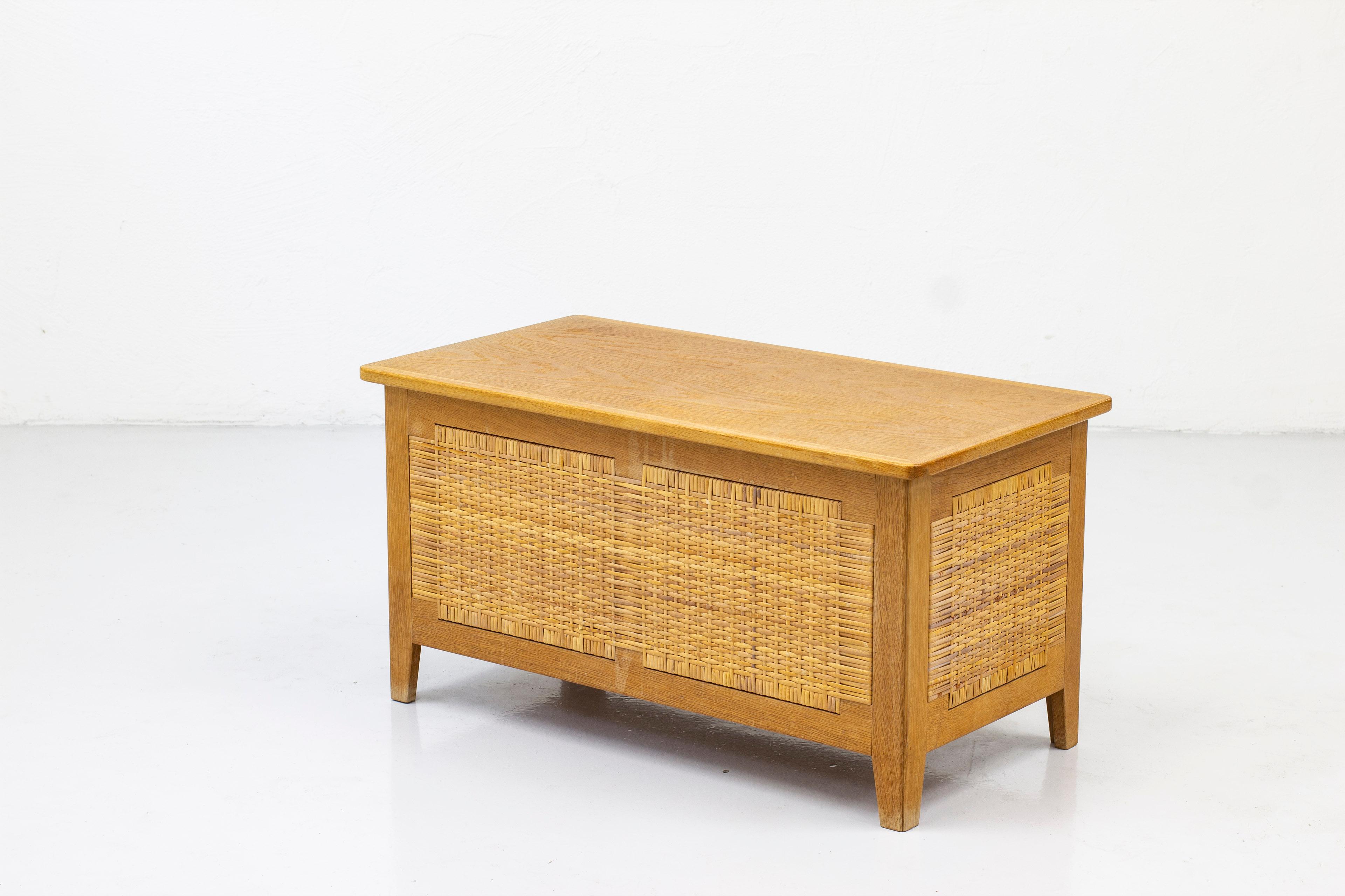 Chest designed by Kai Winding. produced in Denmark during the 1950s by Poul Hundevad . Made from oak with hand woven cane and patinated brass hardware. Very good condition with few signs of age related wear and patina.

A striking Danish modern