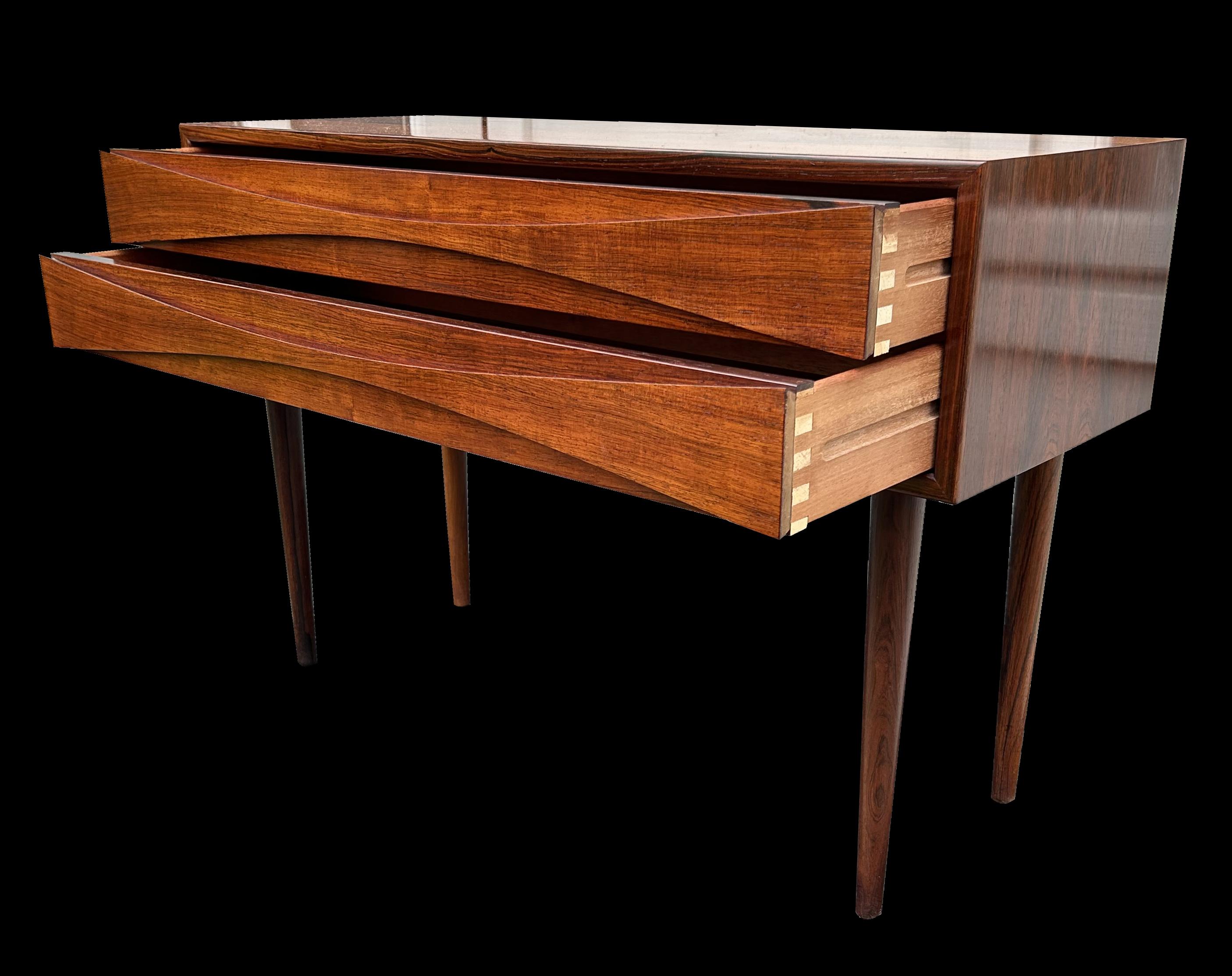 A super Santos Rosewood 2 drawer chest/cabinet by Neils Clausen. Santos Rosewood or Machaerium Scleroxylon is a species not on Citers lists, so is no problem for import/export.