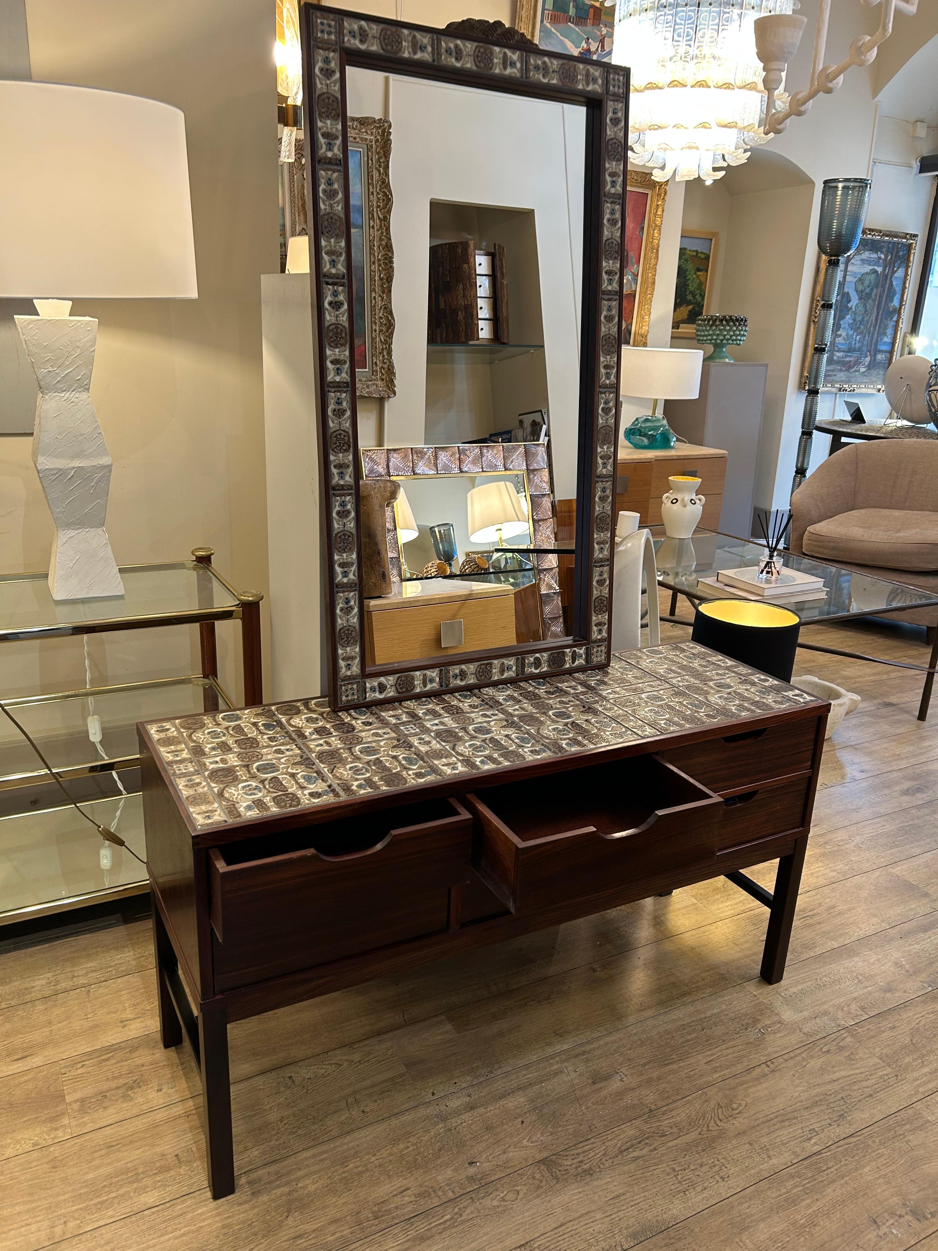 A 6-drawer chest of drawers in rosewood with Royal Copenhagen tile inlays, accompanied by a mirror, makes for a beautiful set. Designed by Severin Hansen and manufactured by Haslev Furniture, Denmark (porcelain stamp, furniture signature, on the