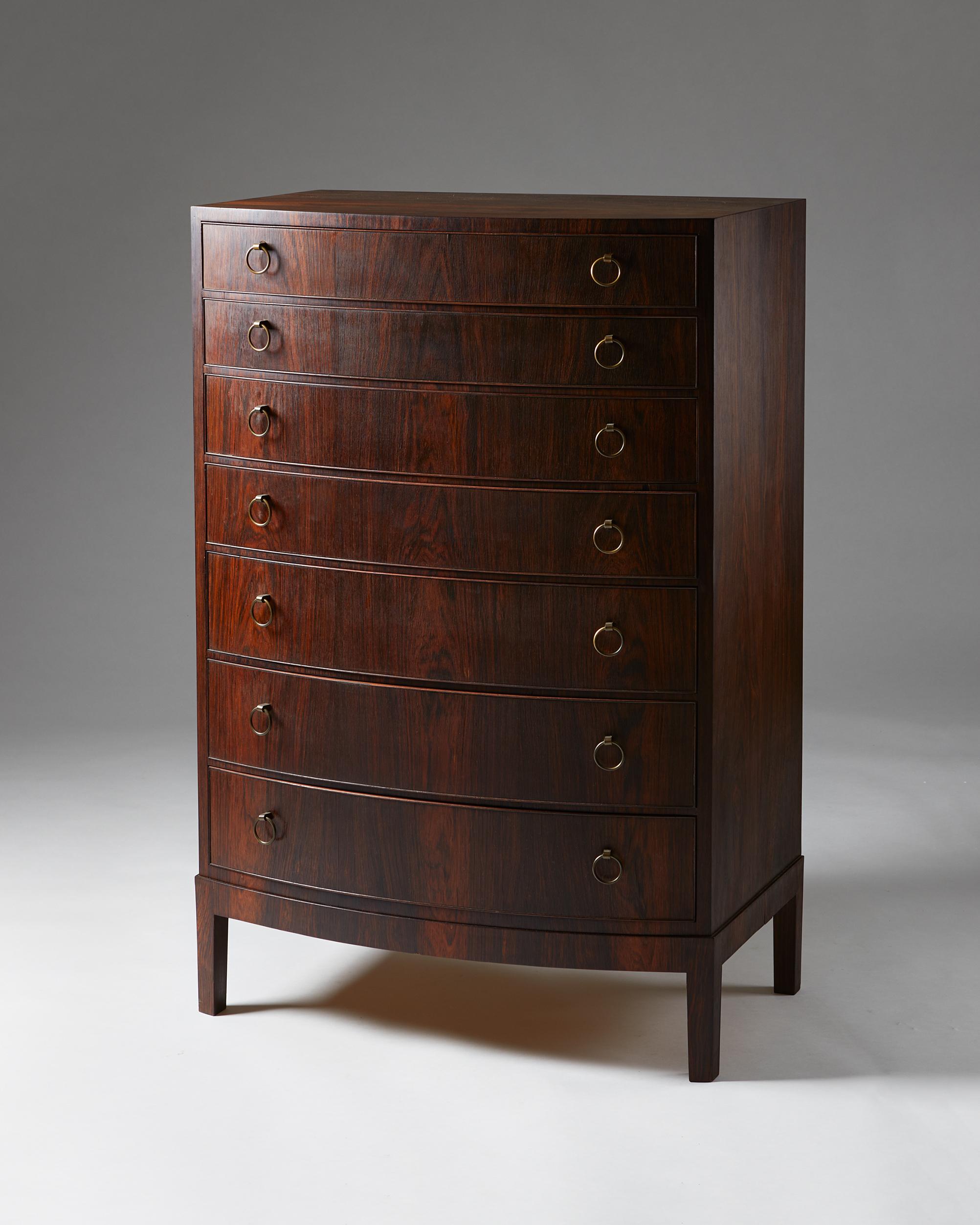 Chest of drawers, anonymous, Denmark. 1950s. 

Rosewood and brass.

Dimensions:
H: 121 cm/ 3' 11 1/2