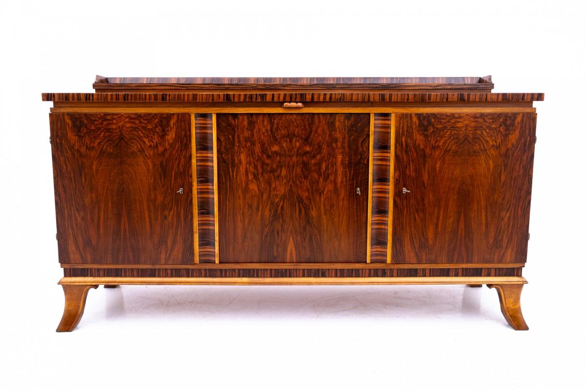 Buffet - Art Deco chest of drawers from the 40s of the last century.

Furniture in very good condition, after professional renovation. The wood was cleaned and finished with a durable varnish.

The chest of drawers has three spacious spaces, each