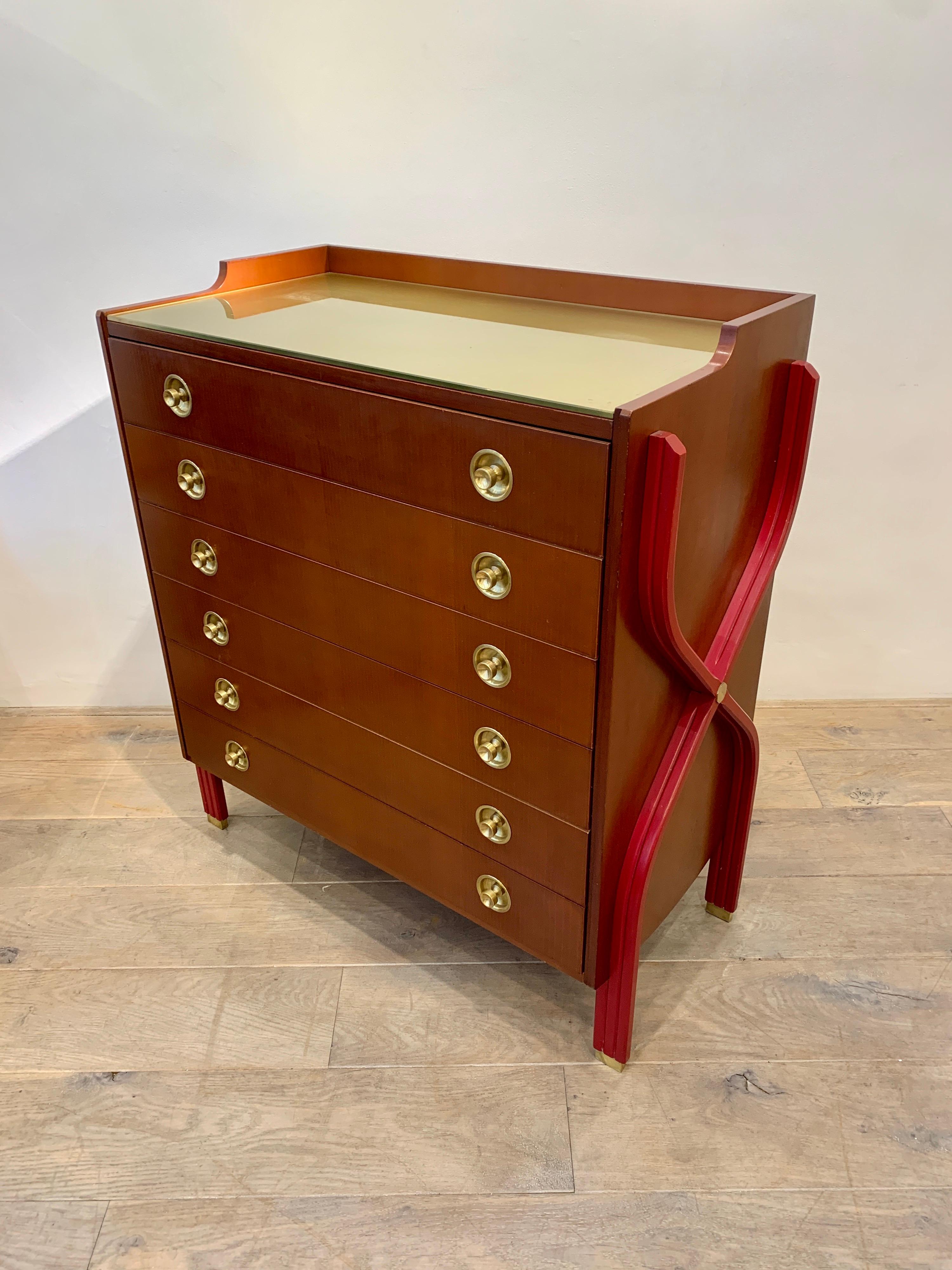 Carlo De Carli is a major Italien designer. His design was avant gardiste at the time, emphasizing the structure giving some lightness to the furniture. The lines have a kind of dynamic movement. The present commode has the characteristic of its