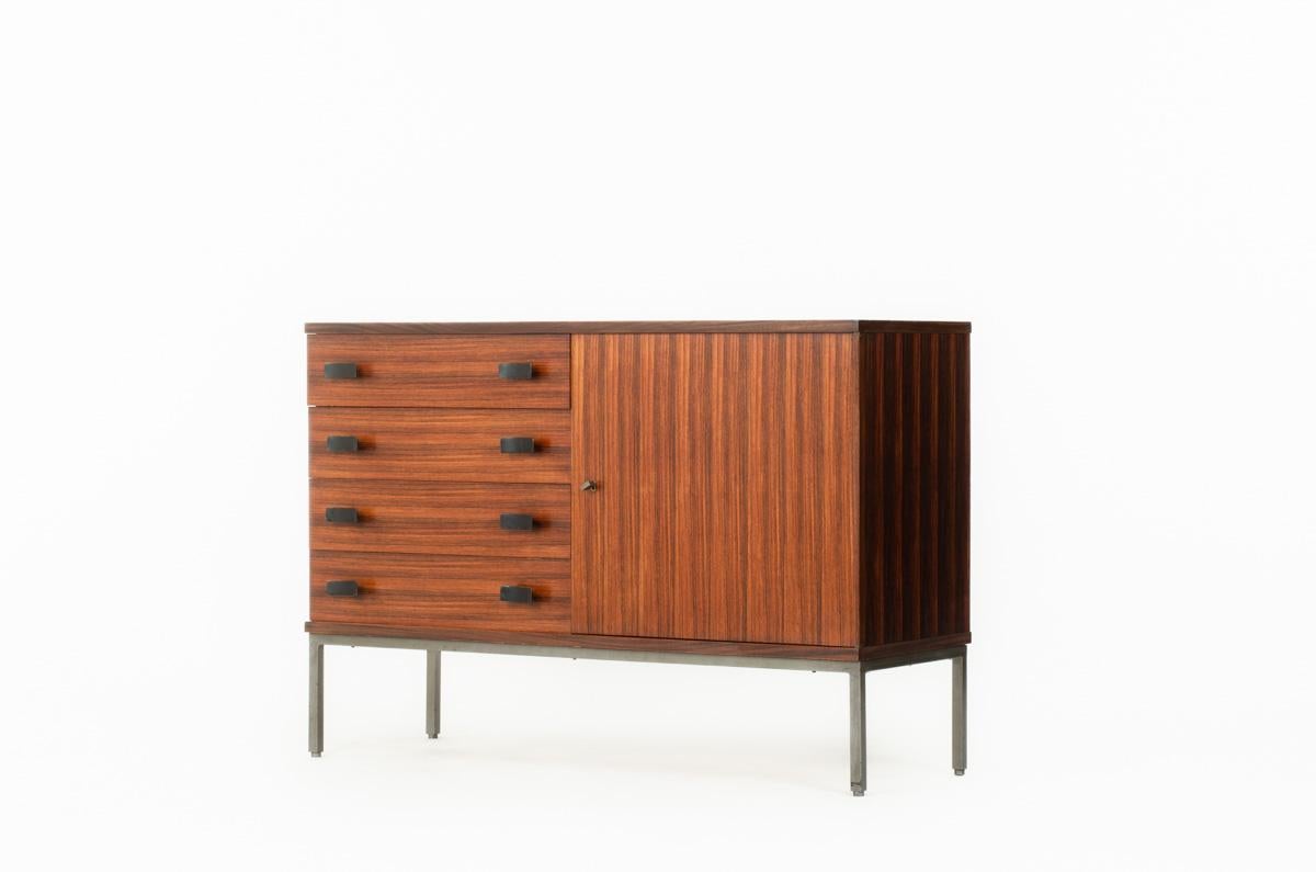 Chest of drawers by Antoine Philippon and Jacqueline Lecoq edited by Degorre
Circa 1960
Wooden structure covered with rosewood veneer, base in metal
4 drawers in front and one opening door
Black lacquered metal handles complete the set
Nice patina