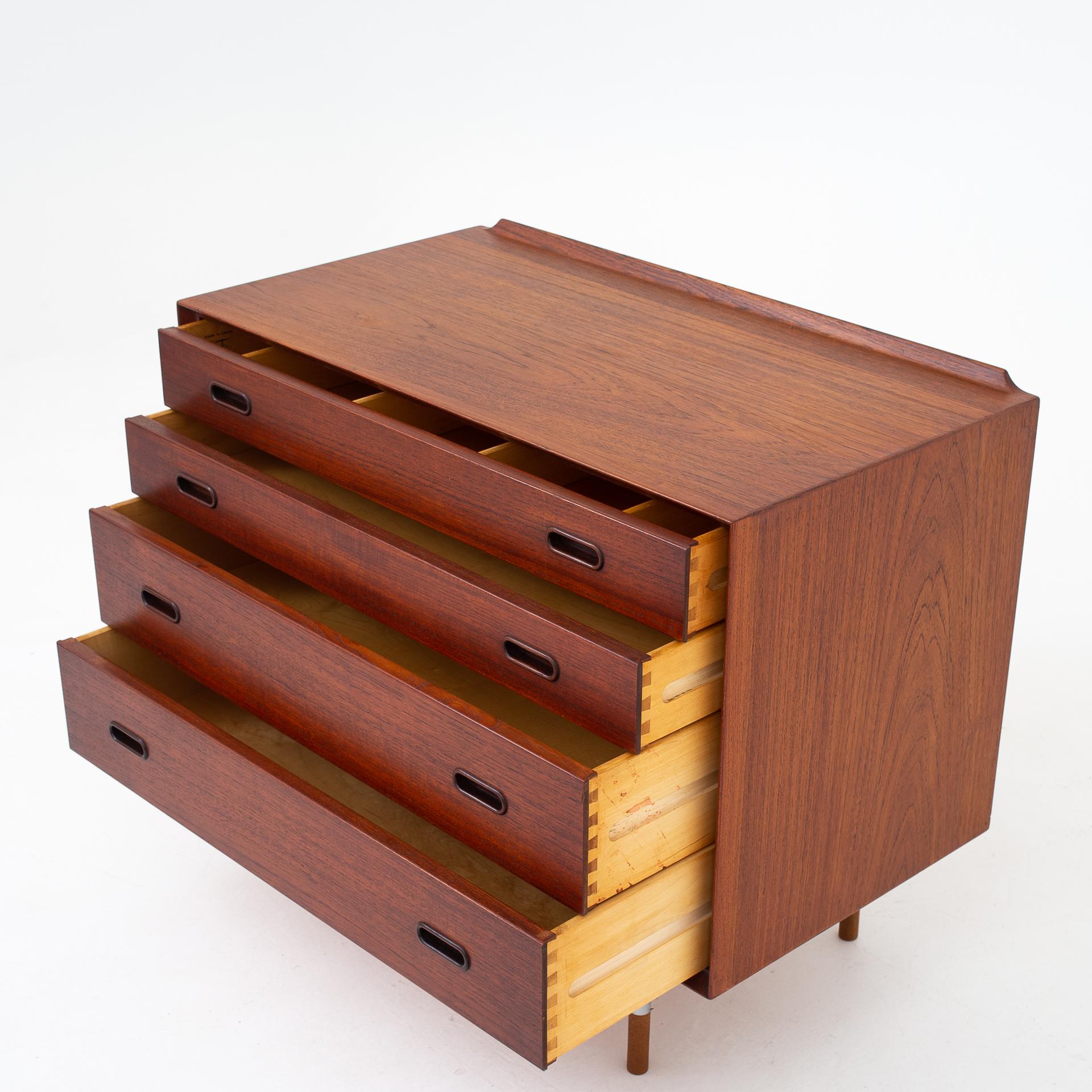 Chest of drawers in teak with round legs of steel and teak. Maker Sibast Furniture.