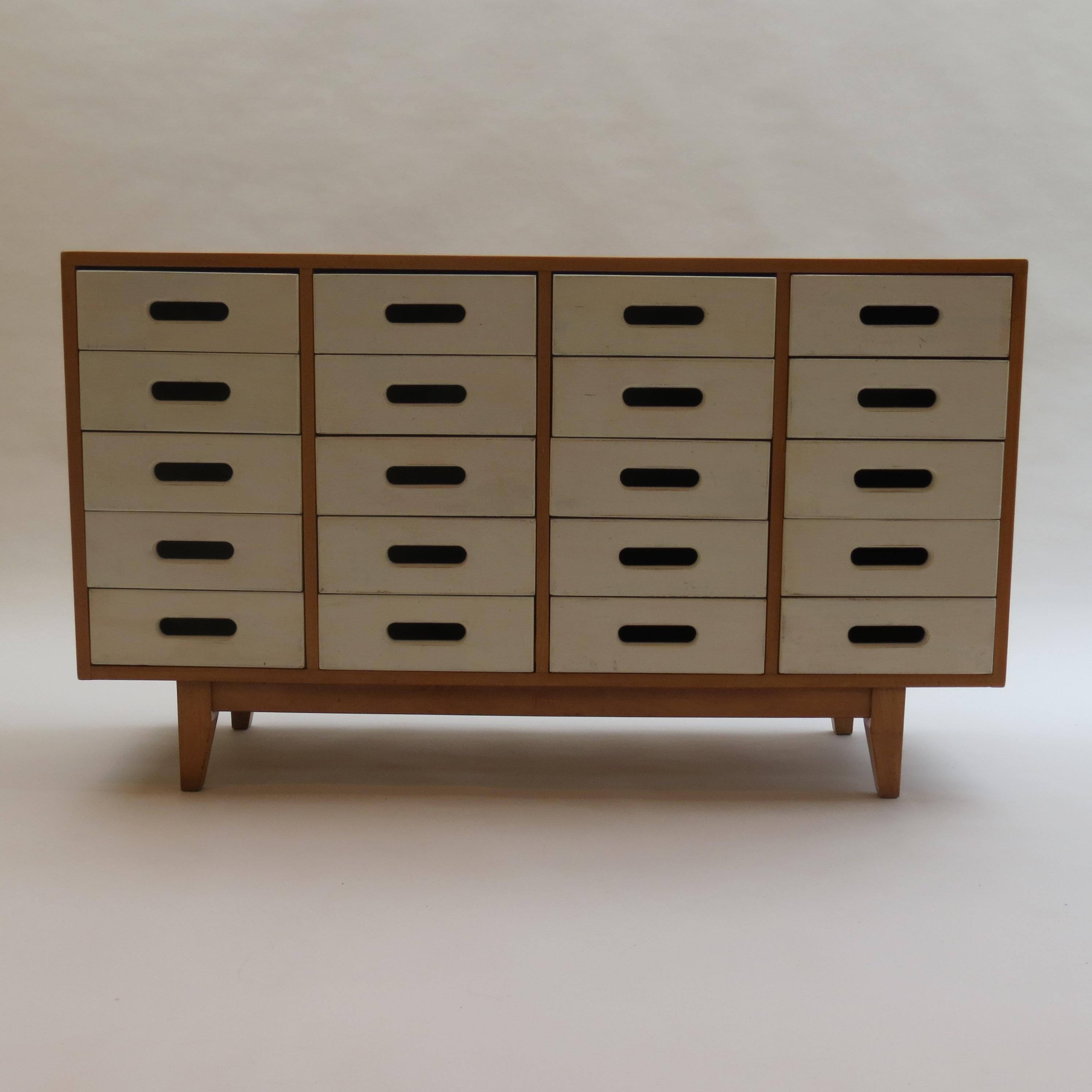 Chest of drawers designed by James Leonard in the 1950s and produced by Esavian, ESA in the United Kingdom. 

Painted solid beech drawer fronts and birch plywood case. The drawer fronts have been overpainted at some point and there is some