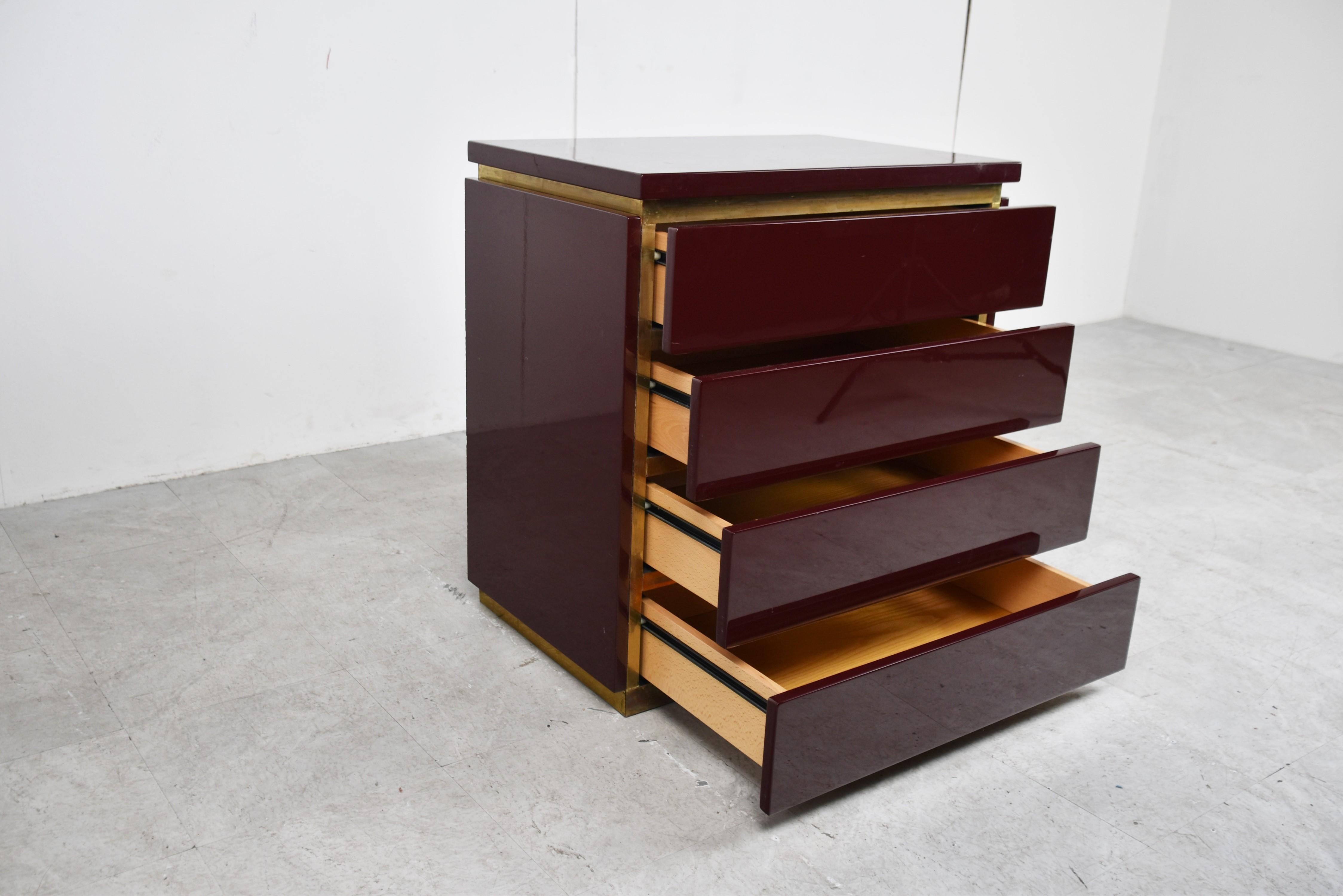 Bordeaux/red lacquered and brass chest of drawers by Jean Claude Mahey.

Jean Claude Mahey always meets the high quality furniture standards and never disappoints.

Seventies/eighties glam

Good overall condition, normal age related