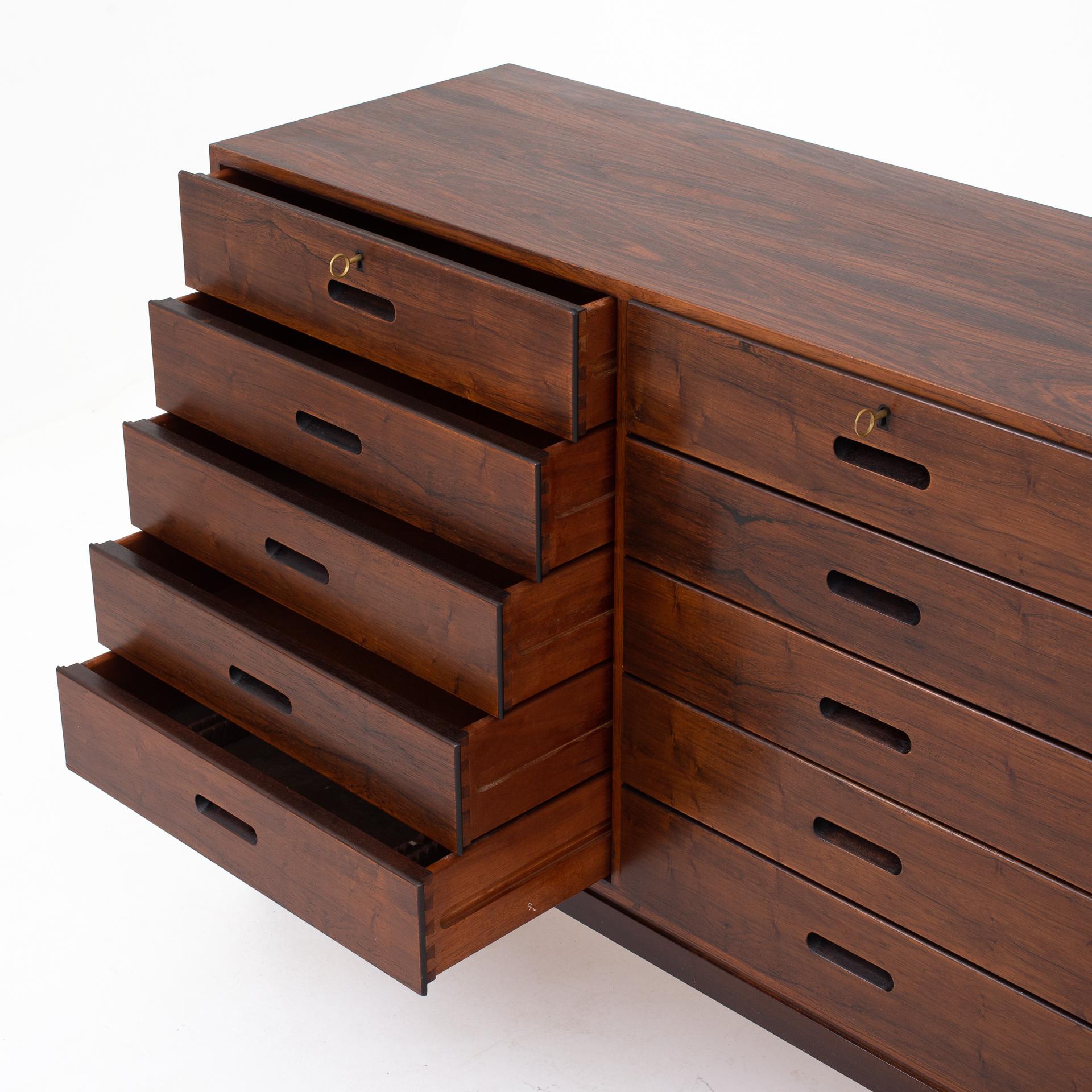 Chest of drawers or drawer cabinet in rosewood with 15 drawers and tapered legs. Maker P. Jeppesen.