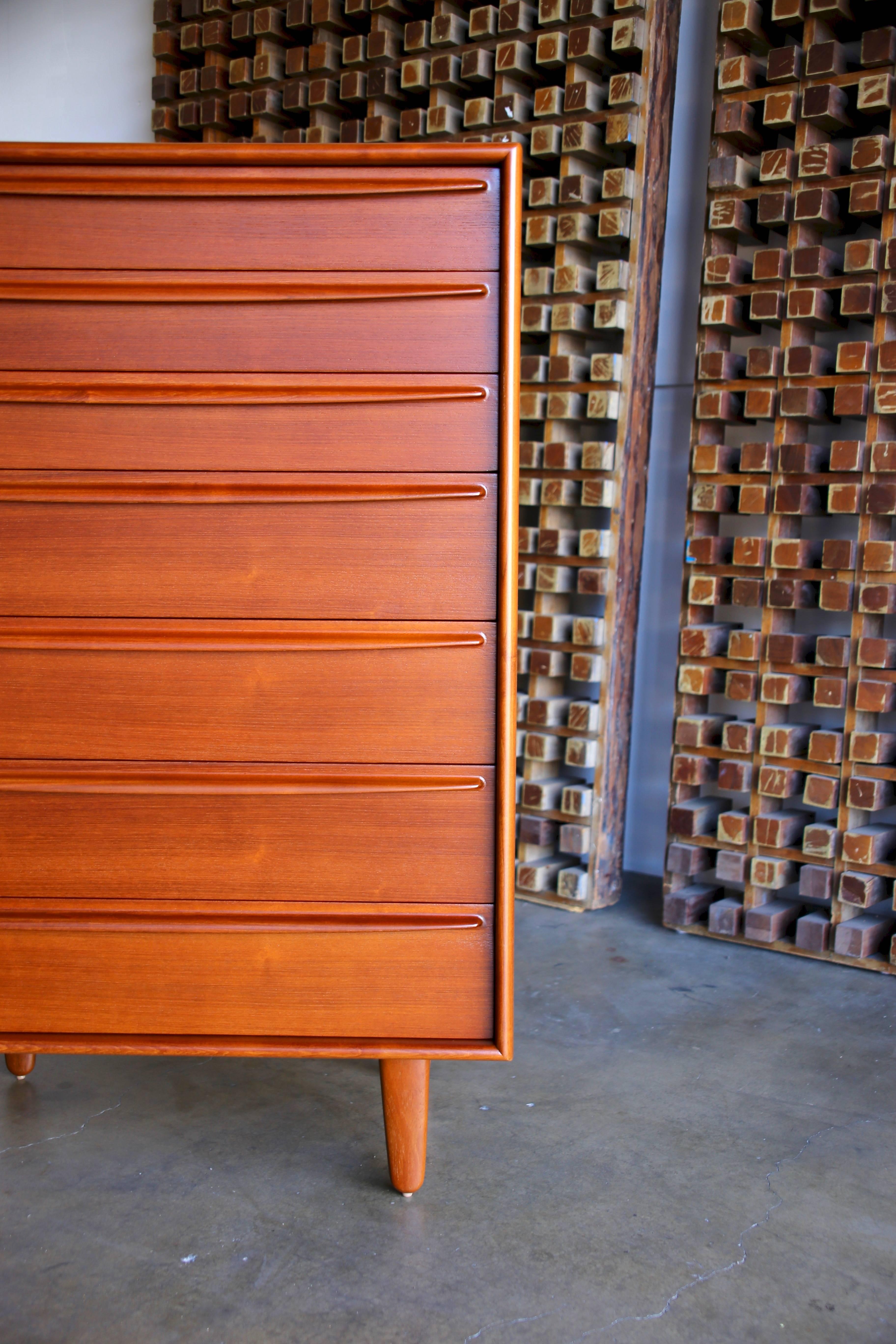 Teak chest of drawers / highboy by Svend Aage Madsen for Falster. This piece has been professionally restored.