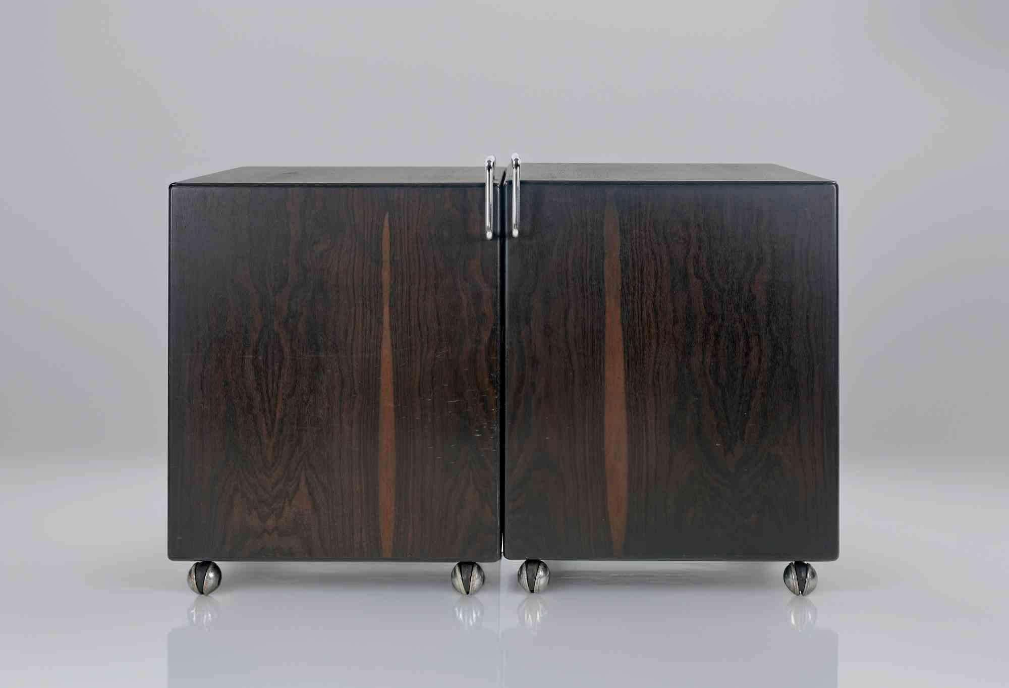Chest of drawers/dressing table realized by Fabio Lenci for Chest of drawers/dressing table realized by Fabio Lenci for Bernini in 1970s.
Two adjustable elements hinged together in solid wood, veneered plywood, chromed steel handles.
Modular