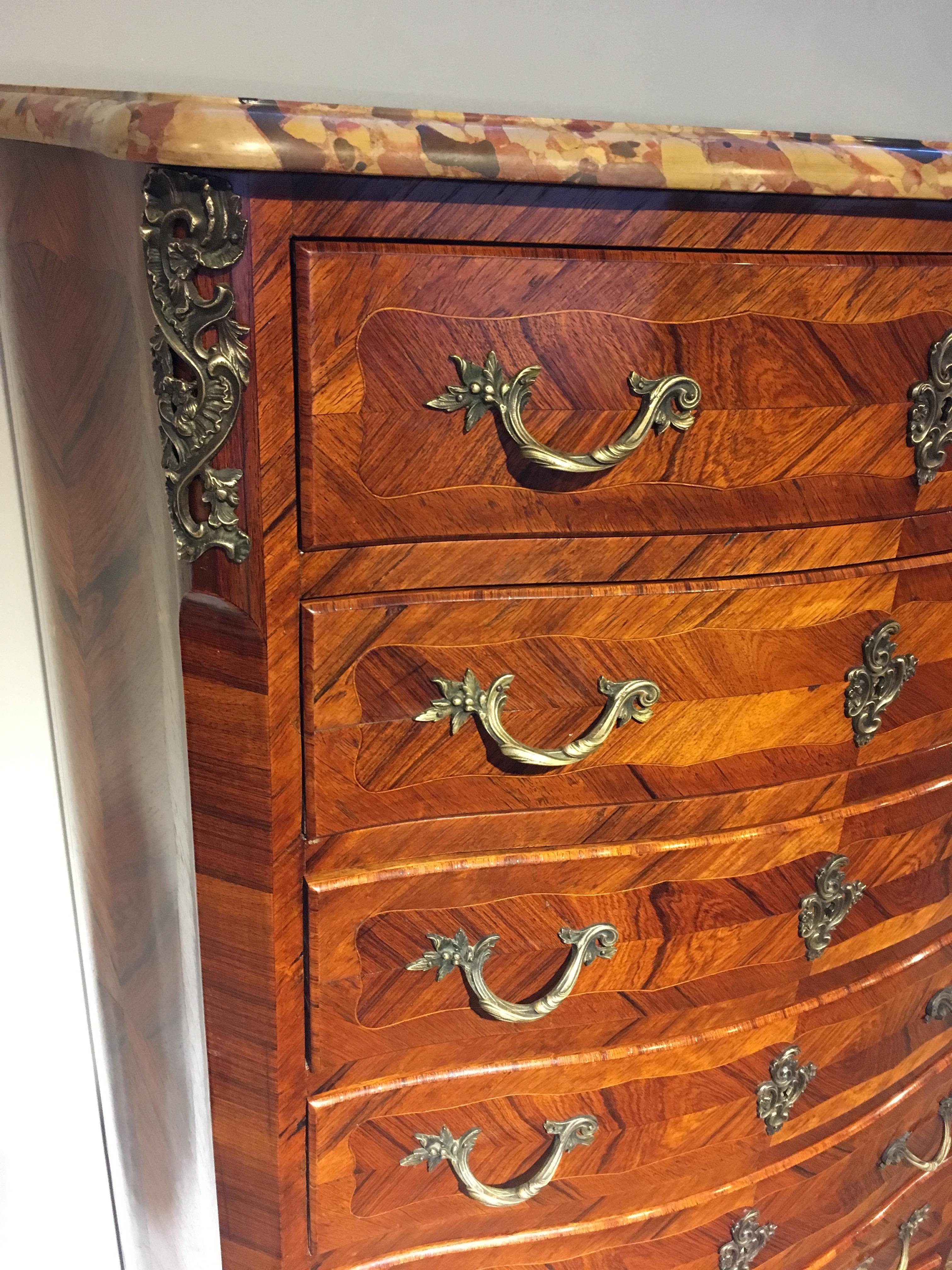Early 20th tall narrow chest of drawers, known as a semainier (drawer for every day of the week.. 

French dating to circa 1910 this piece is veneered with king wood original ormolu mounts.

This piece has been through our workshops been cleaned