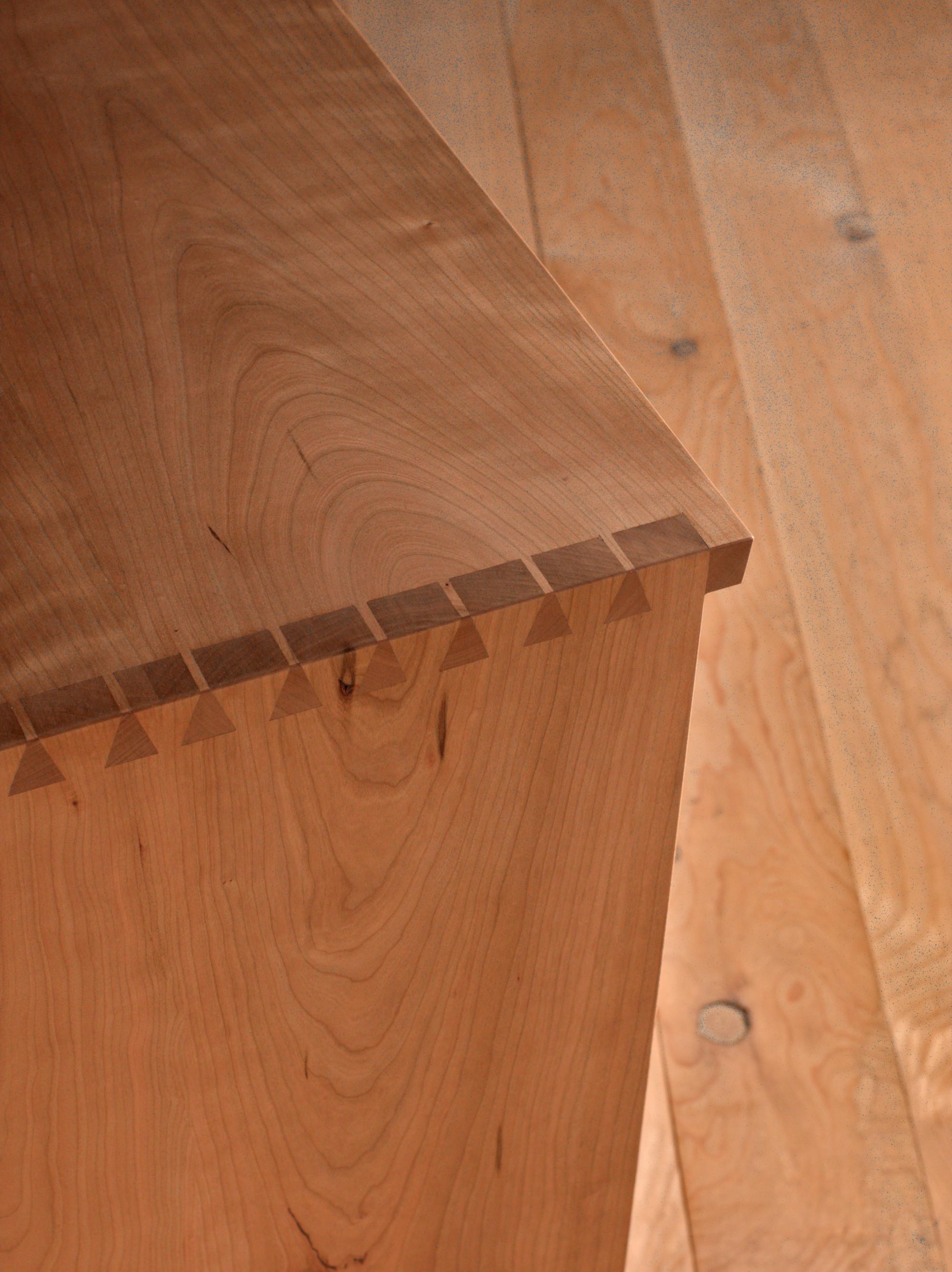 This handcrafted chest of drawers is made from premium black cherry wood, finished with an oil and wax treatment to enhance its natural beauty and durability. Featuring traditional hand-cut dovetail joinery, both the corpus and drawers are designed
