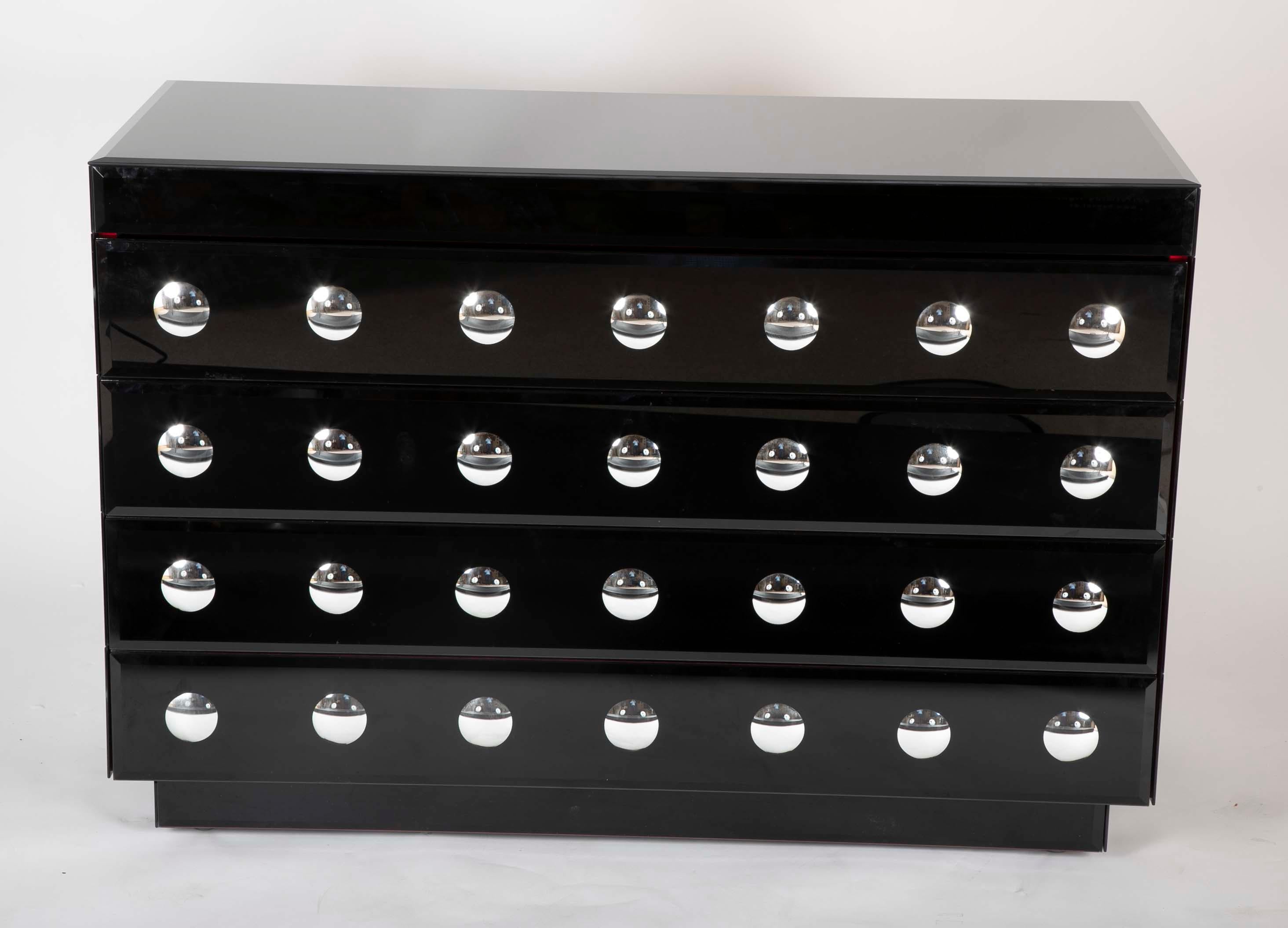 Chest of drawers from the firm of Alberto Pinto with repeating convex mirrors in lacquer ground.