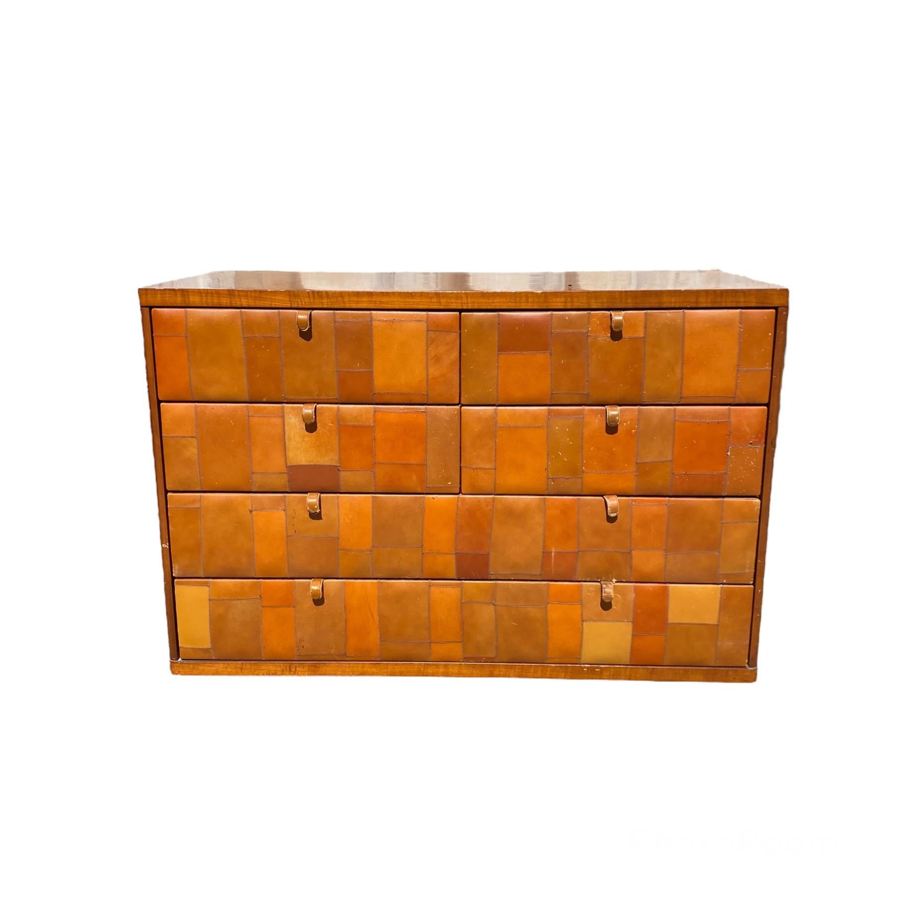 Incredible and very rare chest of drawers designed by Tito Agnoli for Caleido, a Poltrona Frau company in 1970.
The object is of incredible workmanship, with hand-sewn Pecary leather petchwork drawers, using the most precious leather on the market,