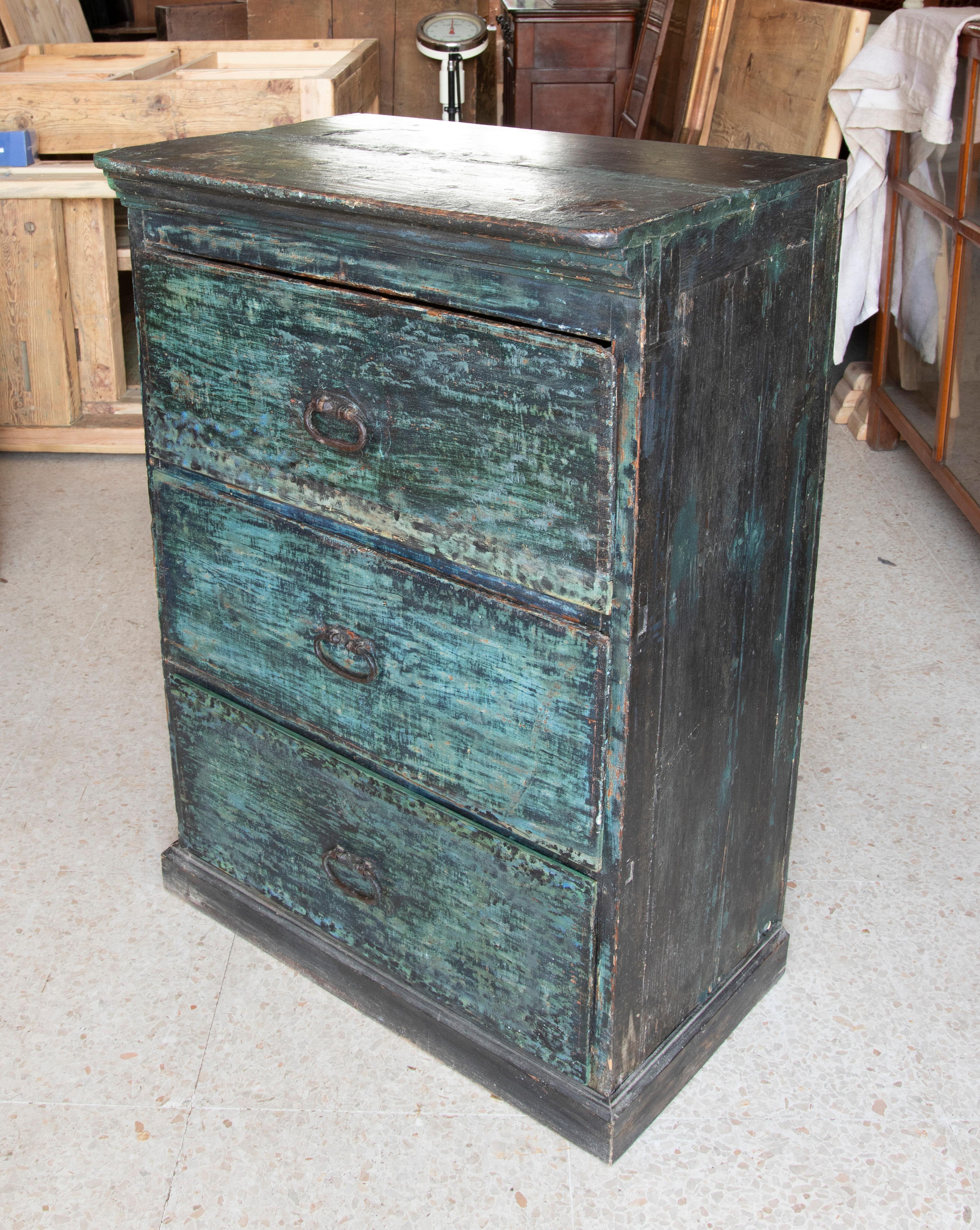 Chest of drawers in Polychromed wood in blue tones with iron handles.