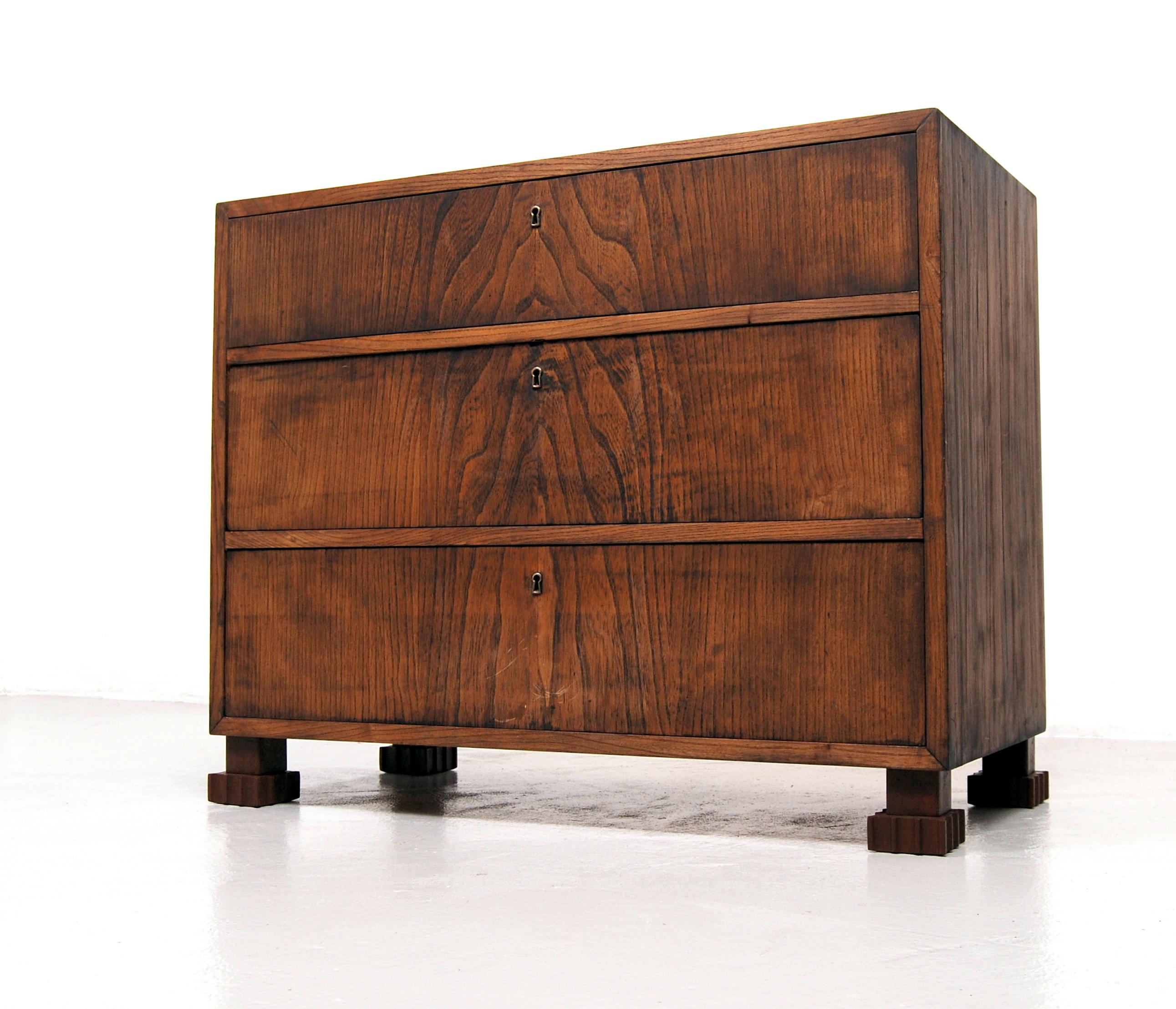 Chest of drawers in the manner of Swedish designer Axel Einar Hjorth with beautiful grained beech wood who has been stained. Manufactured April 22nd, 1941. All three drawers with working locks.
  