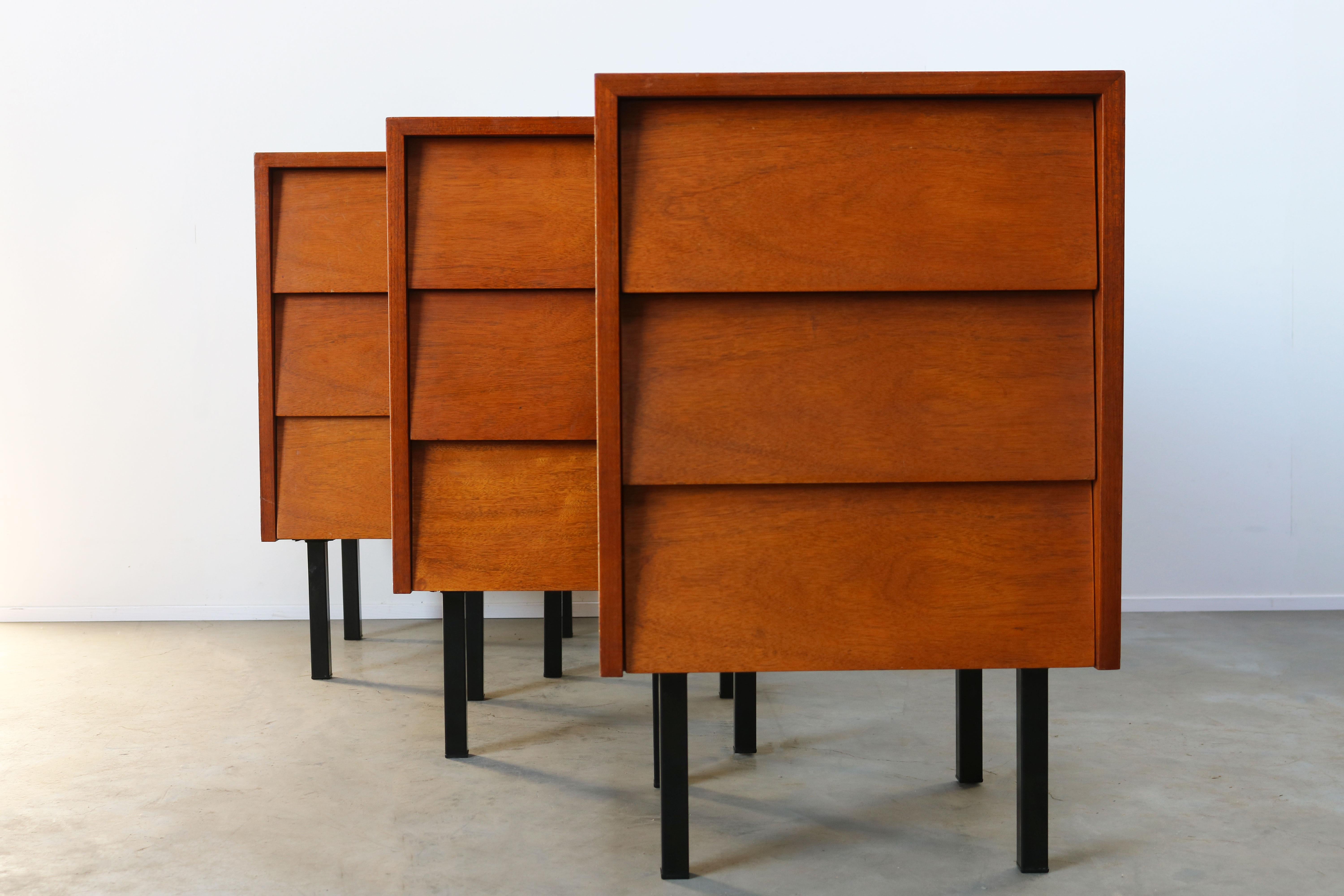 Three Minimalist dressers on night stands by Florence Knoll for Knoll in 1950s. These are a rare early design of Florence and hard to find. The curved grip less drawers combined with the Minimalist black legs make this design for ahead of its time.