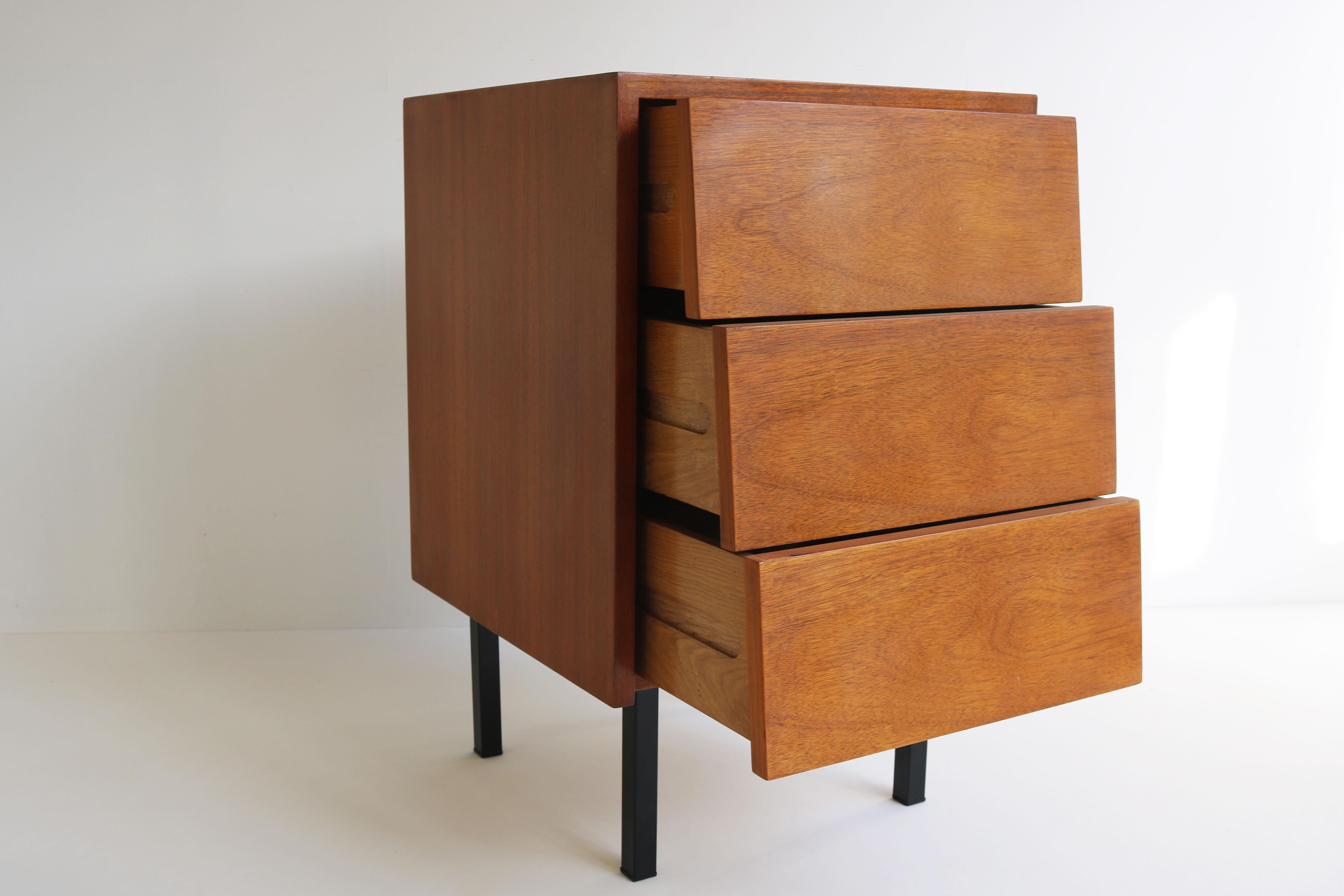 Minimalist dresser / night stand by Florence Knoll for Knoll in 1950s. A rare early design of Florence and hard to find. The curved grip less drawers combined with the Minimalist black legs make this design for ahead of its time. Very clean and