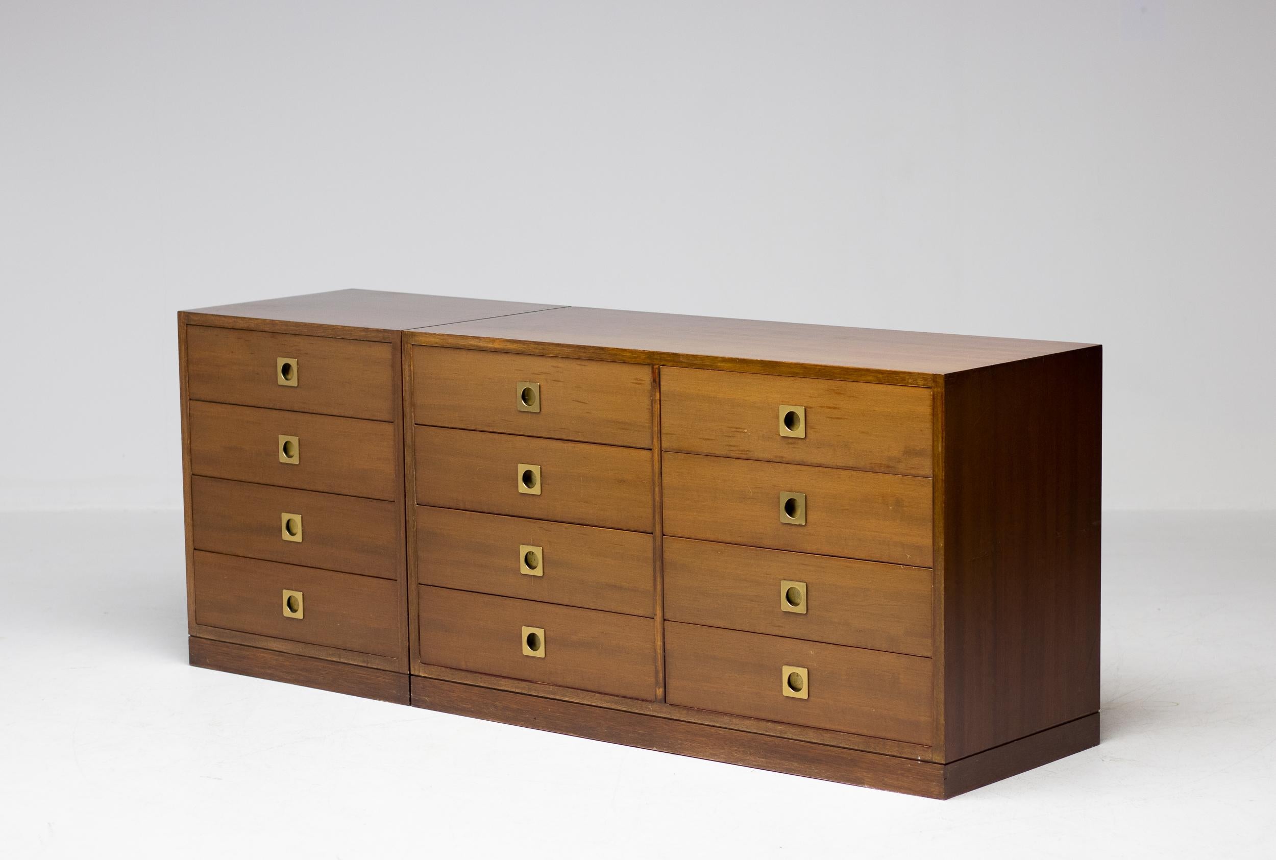 Italian modernist matching pair of walnut and brass chests or drawers attributed to Ico Parisi, manufactured by Spartaco Brugnoli. Refined design with inlaid brass pulls to open the 12 generous size drawers. 
The set is very versatile in use, the