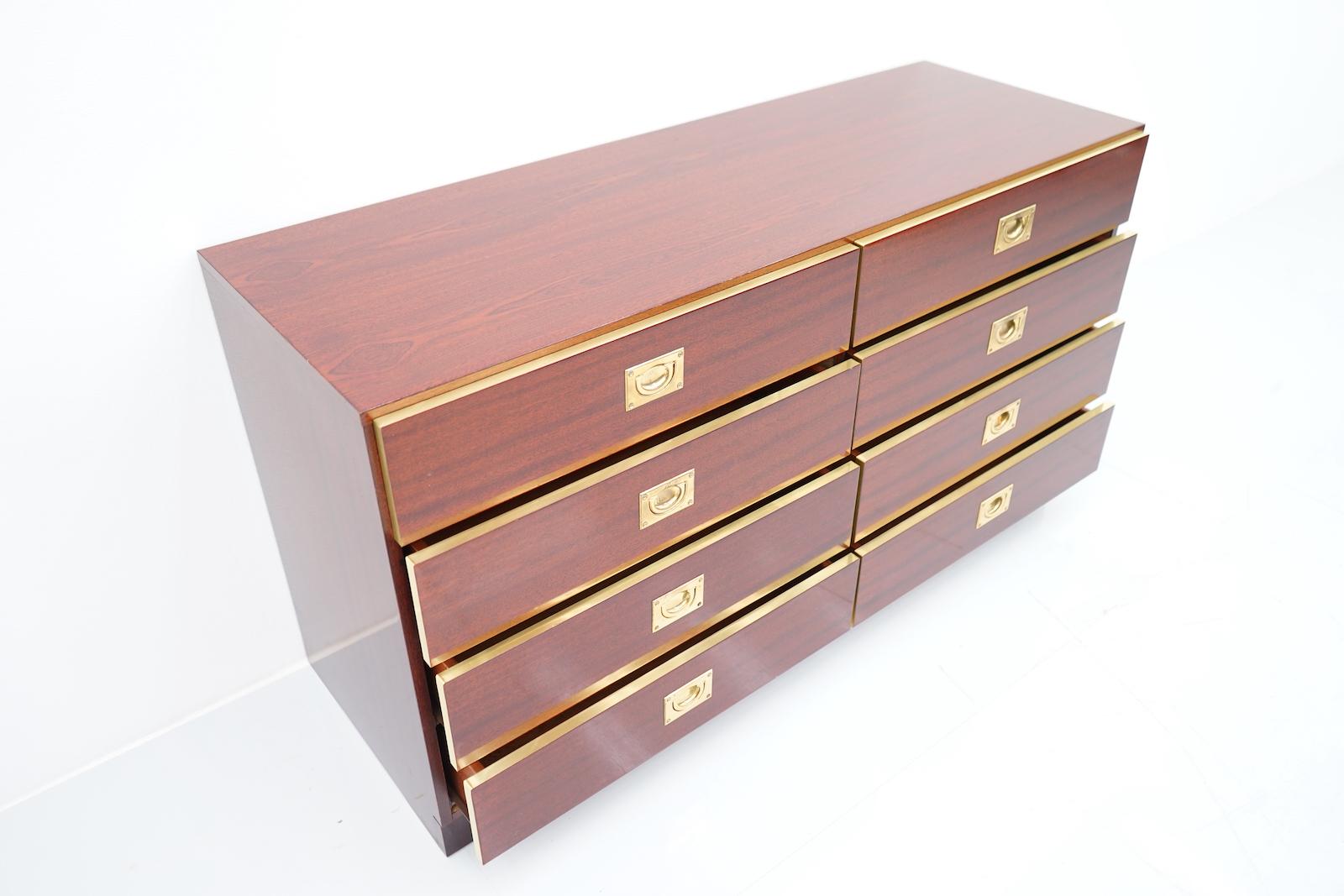 Chest of drawers or sideboard made of mahogany and brass with 8 drawers. 

Dimensions: Height: 23.81 in. (60,5 cm) Width: 44.29 in. (112,5 cm) Depth: 15.55 in. (39,5 cm)
Good to very good condition.