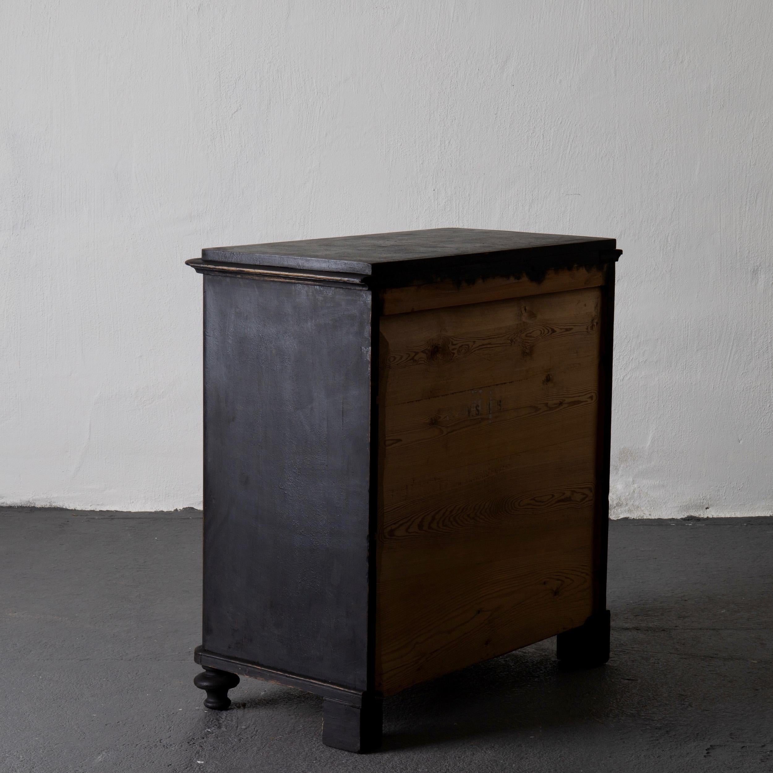 A chest of drawers made during the late 19th century in Sweden. Painted in our Laserow Black. Updated hardware. 

  