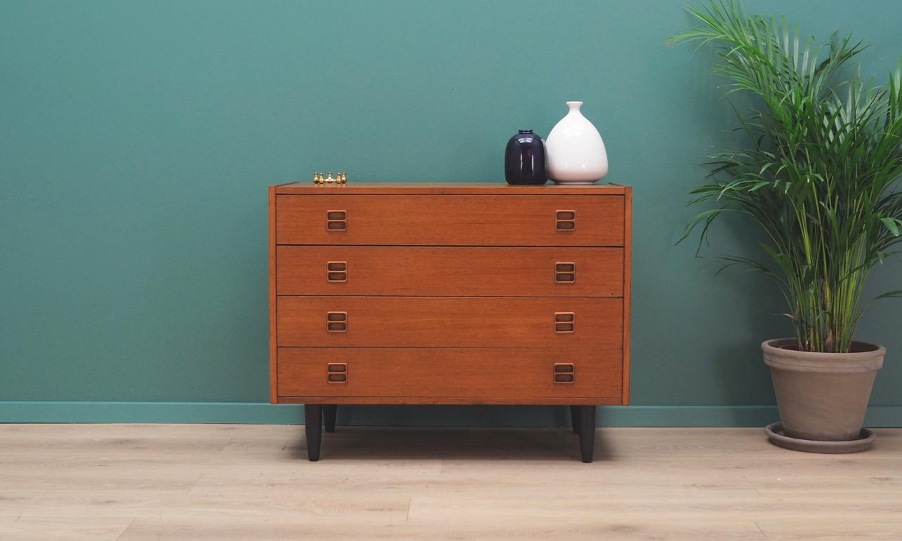 Fantastic Scandinavian chest of drawers from the 1960s-1970s. Minimalist form combining practicality with Classic Danish design. Surface of the furniture is finished with teak veneer. Furniture has four drawers. Maintained in good condition (minor