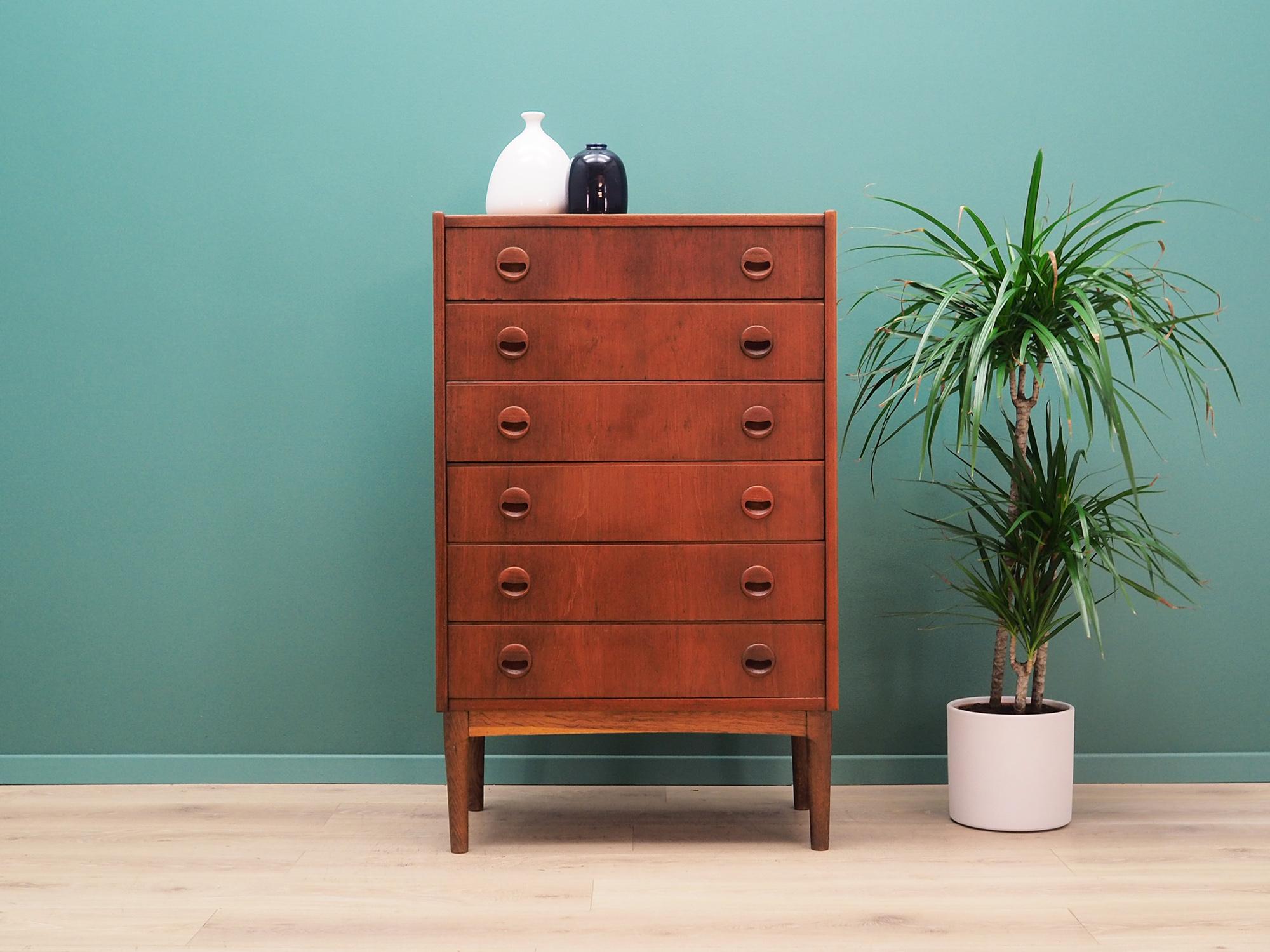 Exceptional chest of drawers from the 1960s-1970s, Minimalist form, Danish design. Surface of the furniture is covered with teak veneer, legs are made of solid teak wood. Furniture has six spacious drawers. Preserved in good condition (minor bruises