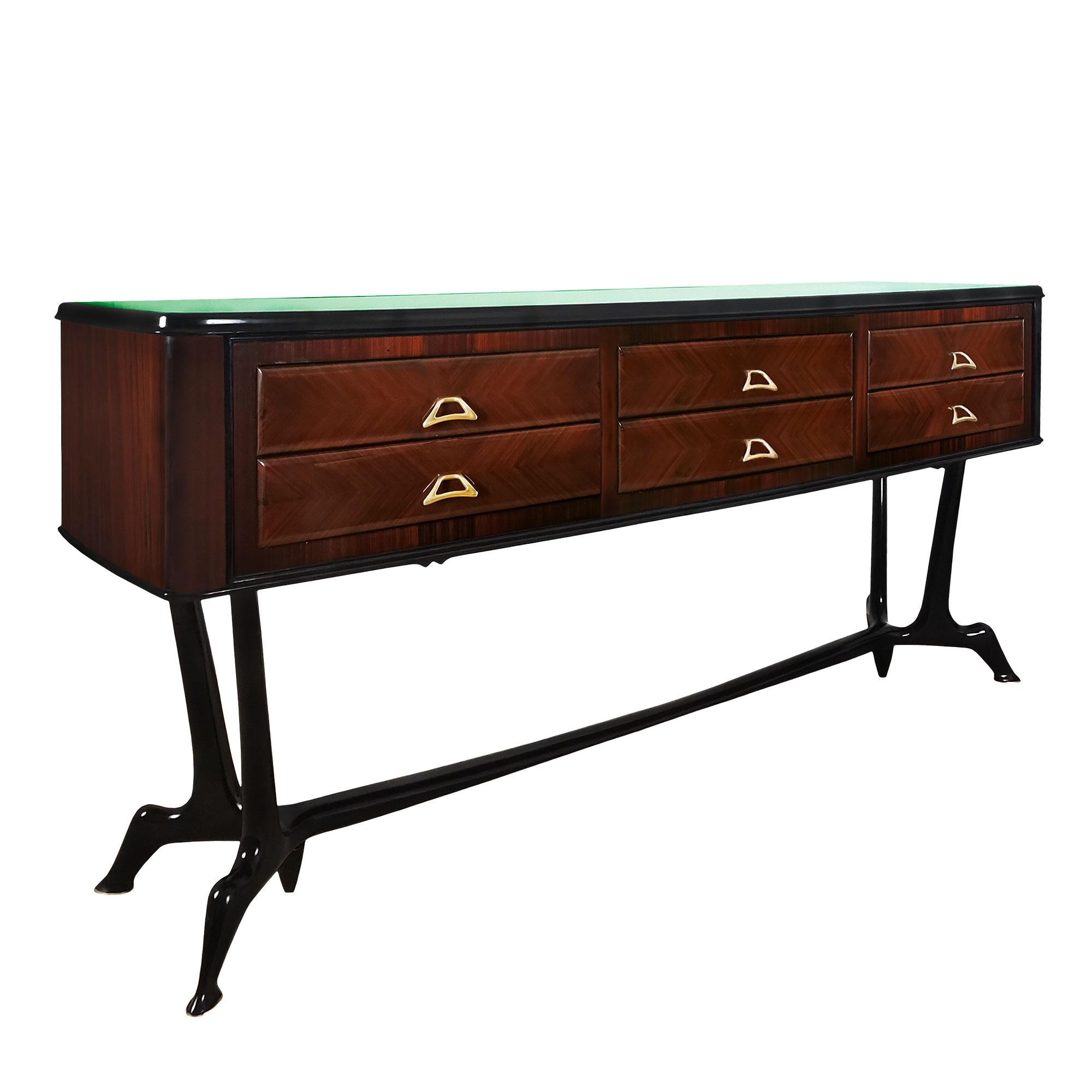 Chest of six drawers in solid wood veneered with walnut, “herringbone” marquetry on the drawers, base in solid stained walnut matching the frame of the original glass top (green in color with a decorative edge). Polished brass knobs and feet
