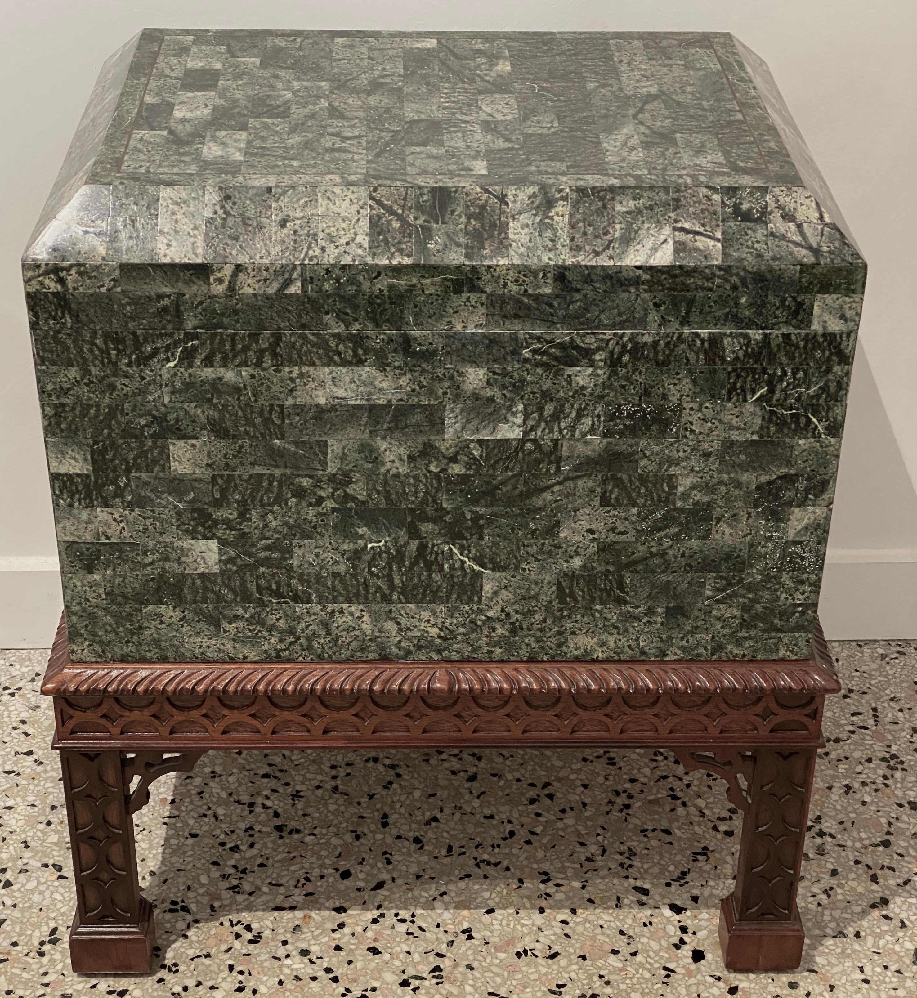 This stylish and chic chest on stand was created by Maitland Smith in the 1980s-1990s and is fabricated in tessellated marble and a hand-carved mahogany stand.

Note: Box dimensions are 13.25