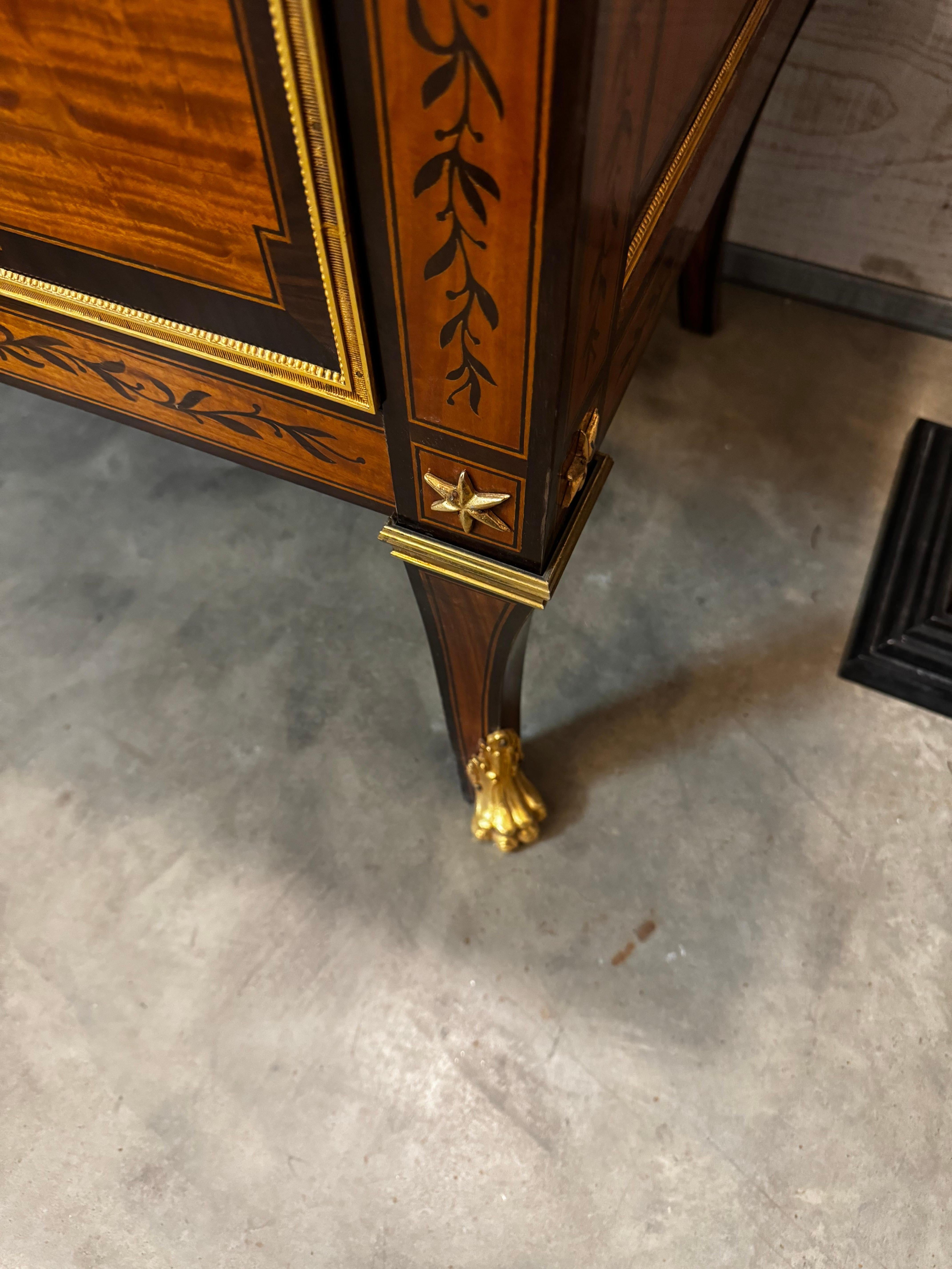 We have two of these amazing chests available. The drawers are lined with felt. The gilt bronze details are quite nice. 