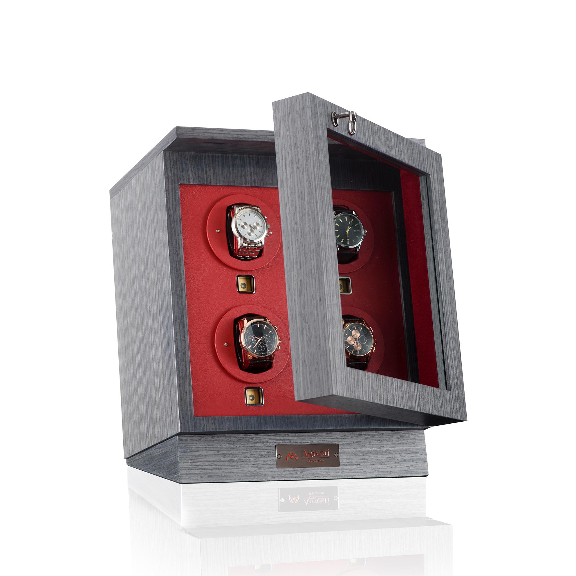 Case in smoked grey oak with four Swiss-made winders, red leather lining, touch switch, glass display window.
Brass accessories with ruthenium finish.

 
