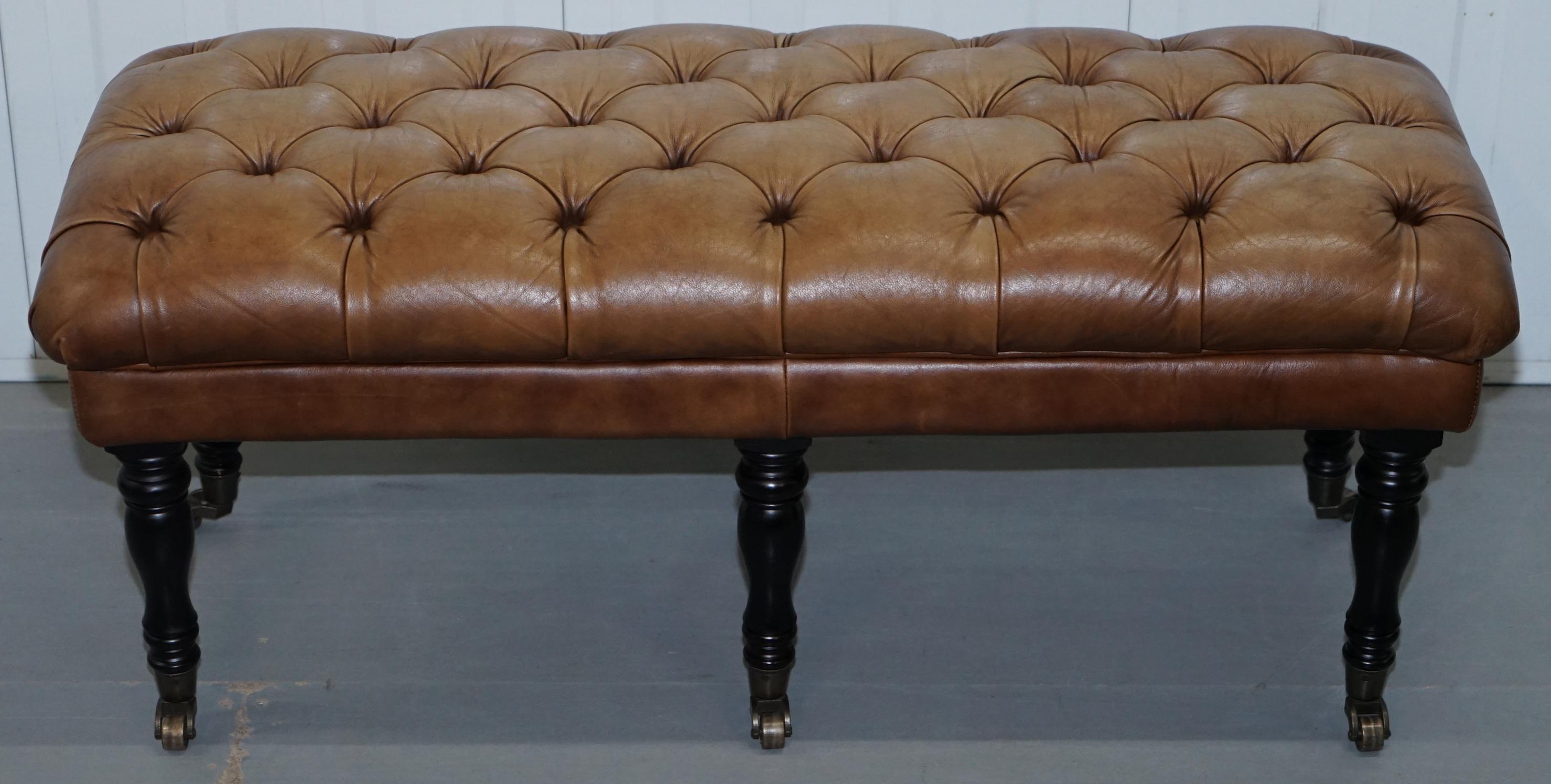 We are delighted to offer for sale this very nice Chesterfield aged tan brown leather bench stool

A good looking well made and decorative piece, ideally suited as a bench seat perhaps for a bay window or can be used as a large footstool

We