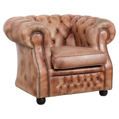 Used Chesterfield armchair in English style made of cowhide leather