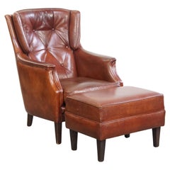 Chesterfield armchair with ottoman made of sheepskin leather