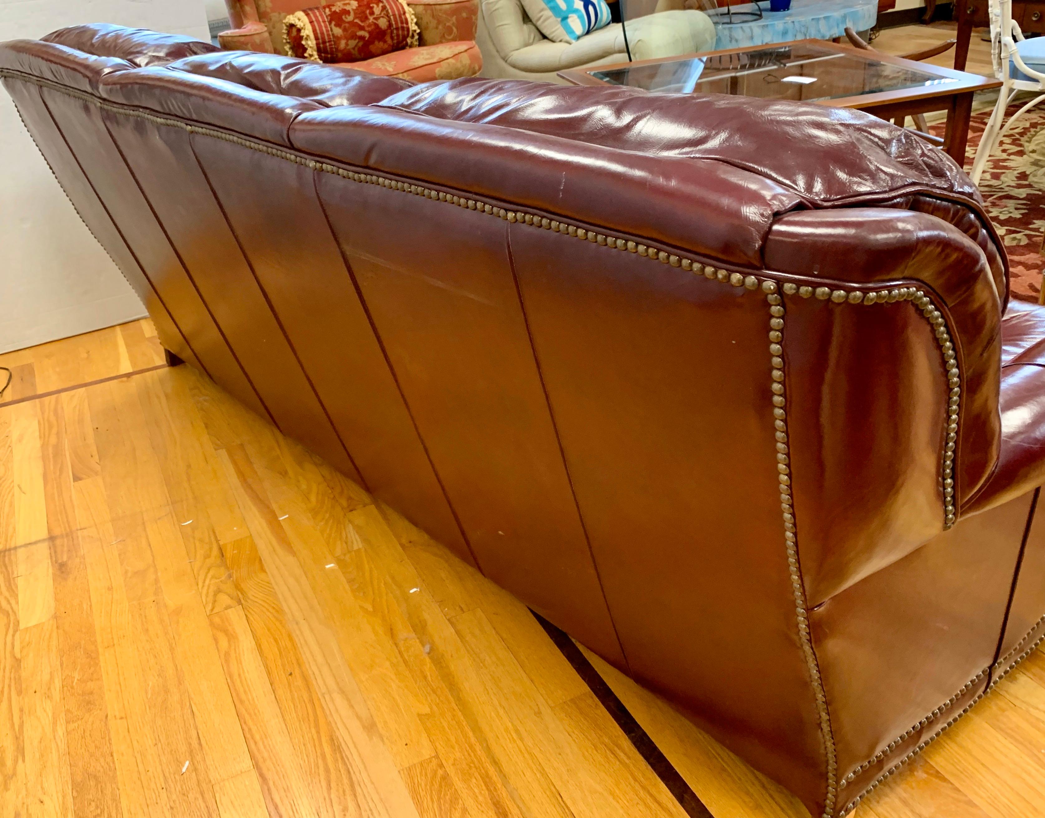 Chesterfield Burgundy Leather Sofa with Brass Nailheads In Good Condition In West Hartford, CT