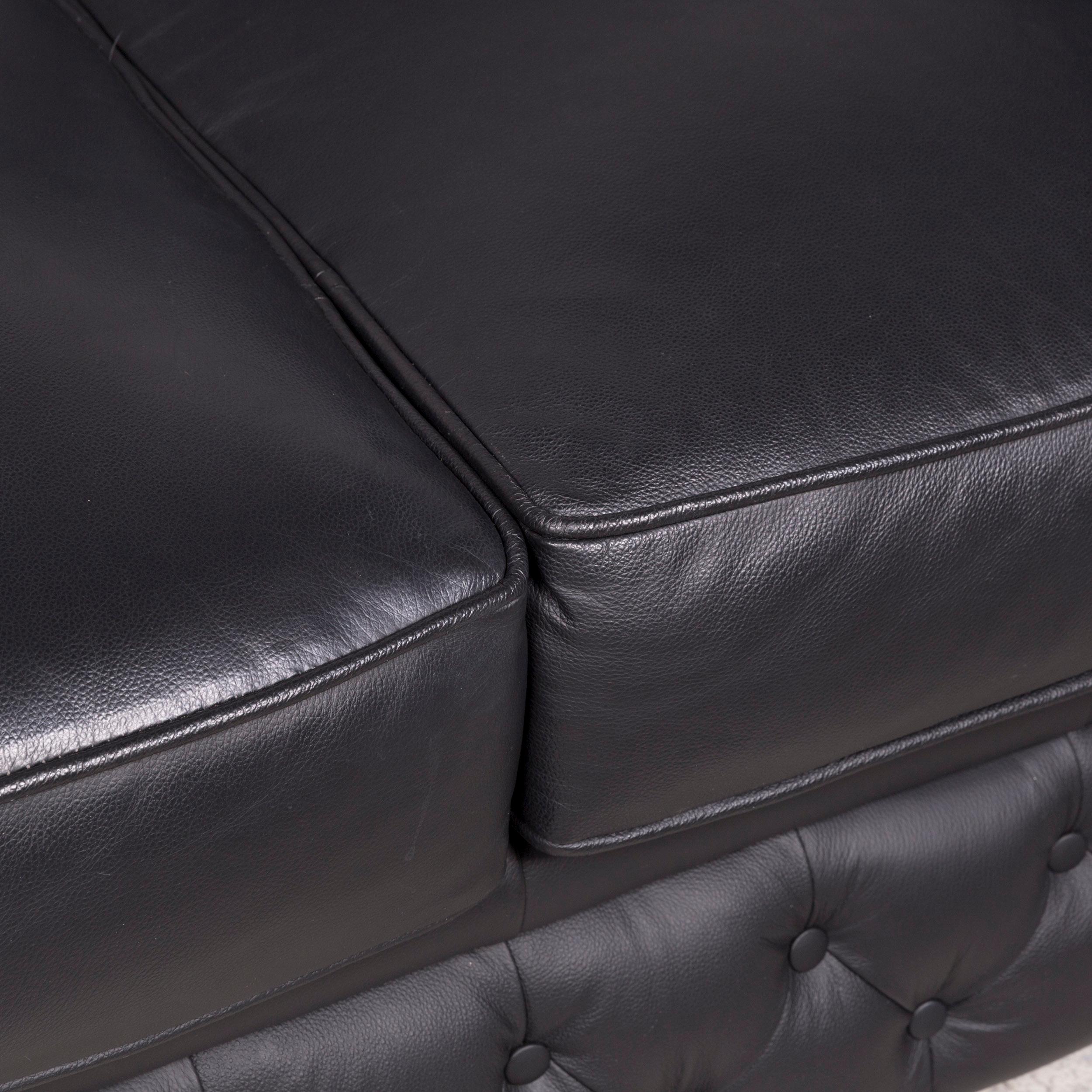 three seater black leather sofa